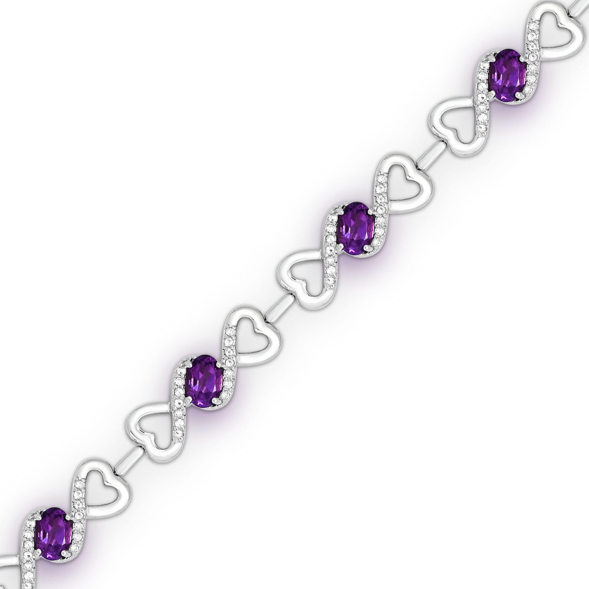 This stunning bracelet features 7 oval-cut amethysts accented by round white topaz gemstones, delicately set in high-quality sterling silver creative double-open heart chains with a secure lobster closure. This bracelet is not only beautiful but
