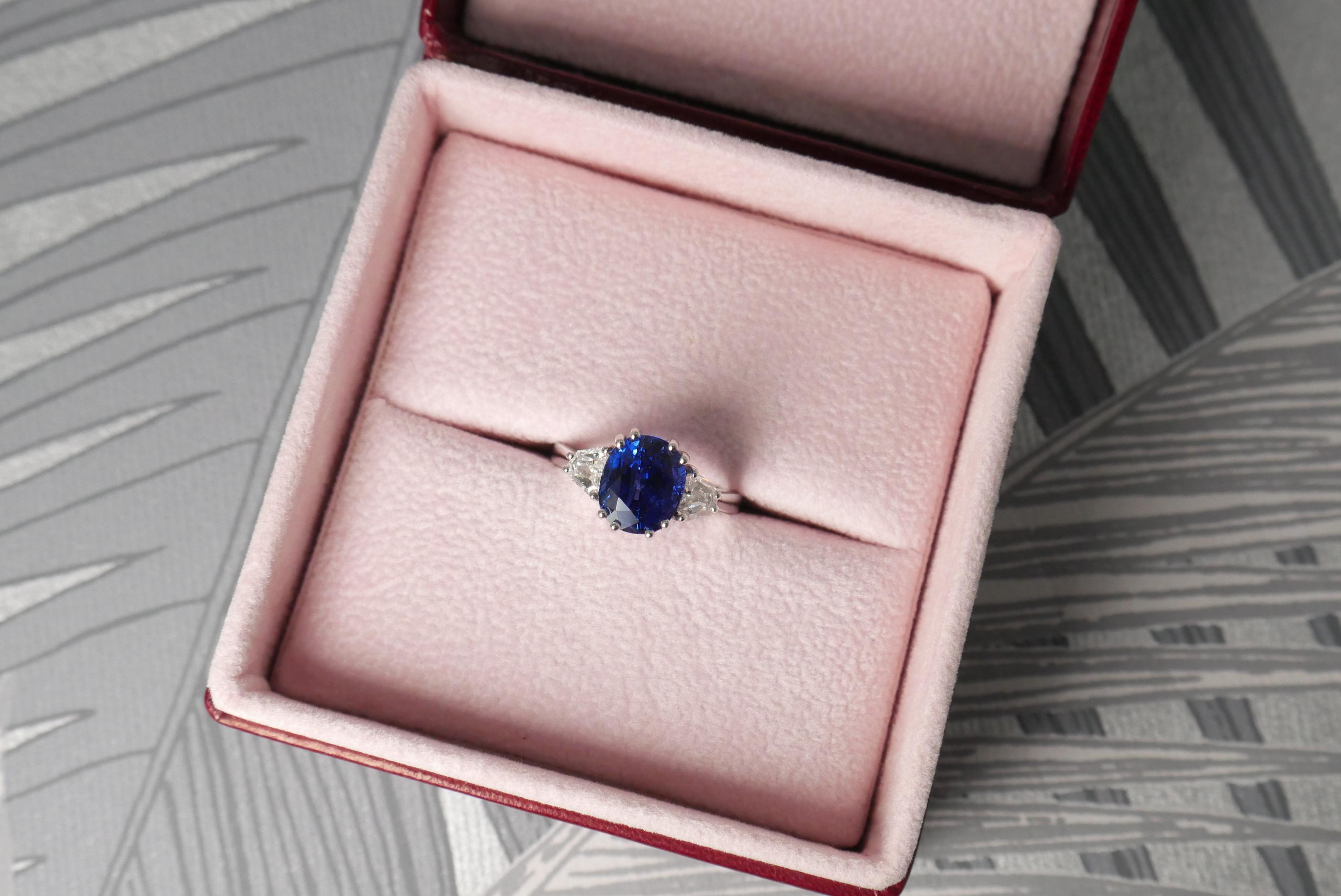 Oval Cut 4 Carat Oval Blue Sapphire Three-Stone Ring in White Gold For Sale