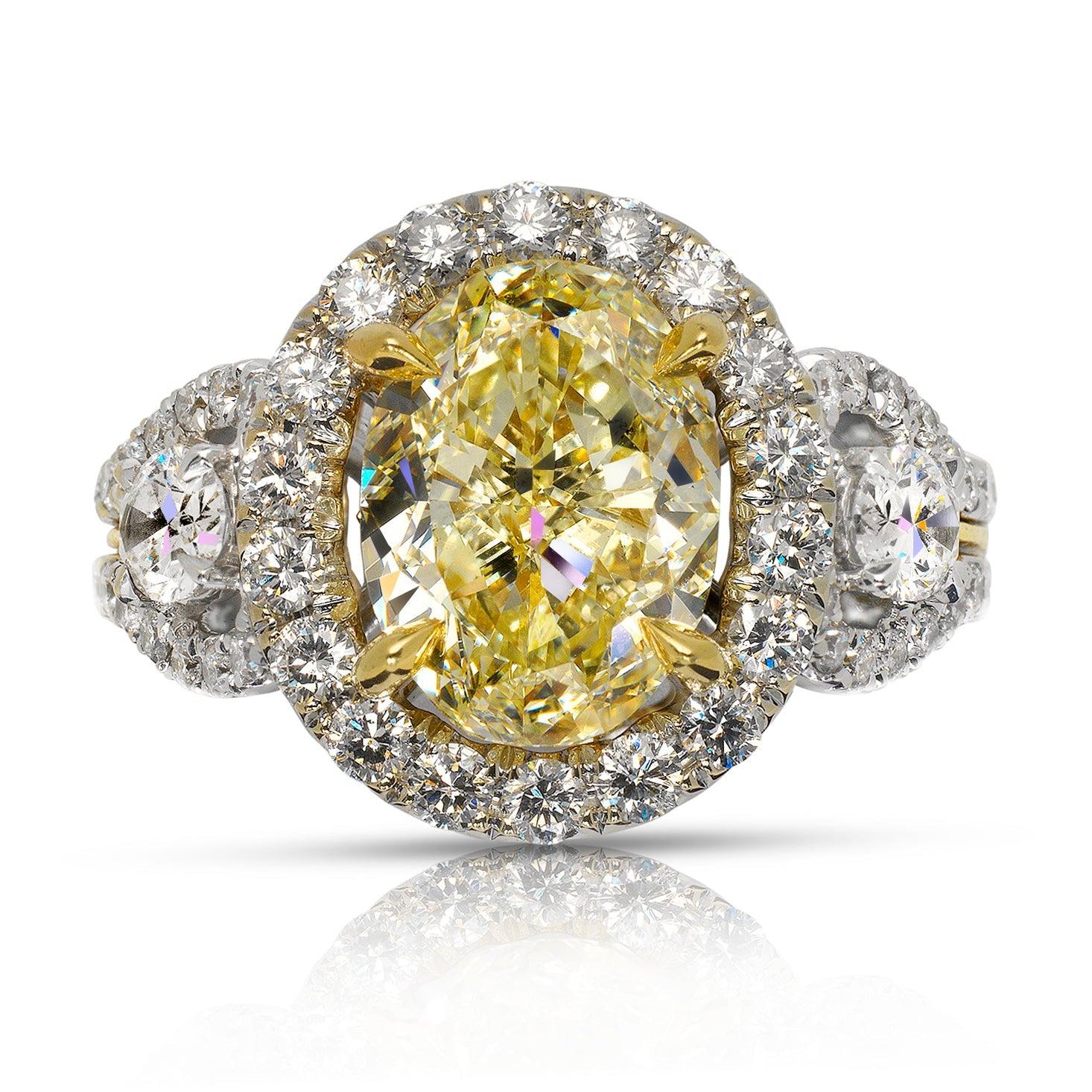 LIZA -OVAL CUT FANCY LIGHT YELLOW DIAMOND ENGAGEMENT HALO AND THREE STONE RING BY MIKE NEKTA
GIA CERTIFIED
Center Diamond:
Carat Weight: 3 Carats
Color : FANCY LIGHT YELLOW -FLY
Clarity: SI2
Style: OVAL BRILLIANT
Approximate Measurements: 10.2 x 7.5