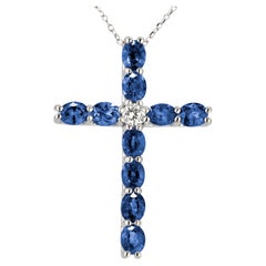 4 Carat Oval Sapphire Cross Pendant With 0.16 Carat Diamond in 18k White Ref984