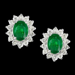 4 Carat Oval Shape Emerald and Diamond Post Back Earrings 14 Karat White Gold