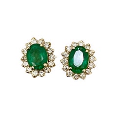 4 Carat Oval Shape Emerald and Diamond Post Back Earrings 14 Karat Yellow Gold