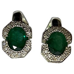 4 Carat Oval Shape Emerald and Diamond Omega Back Earrings 14 Karat White Gold