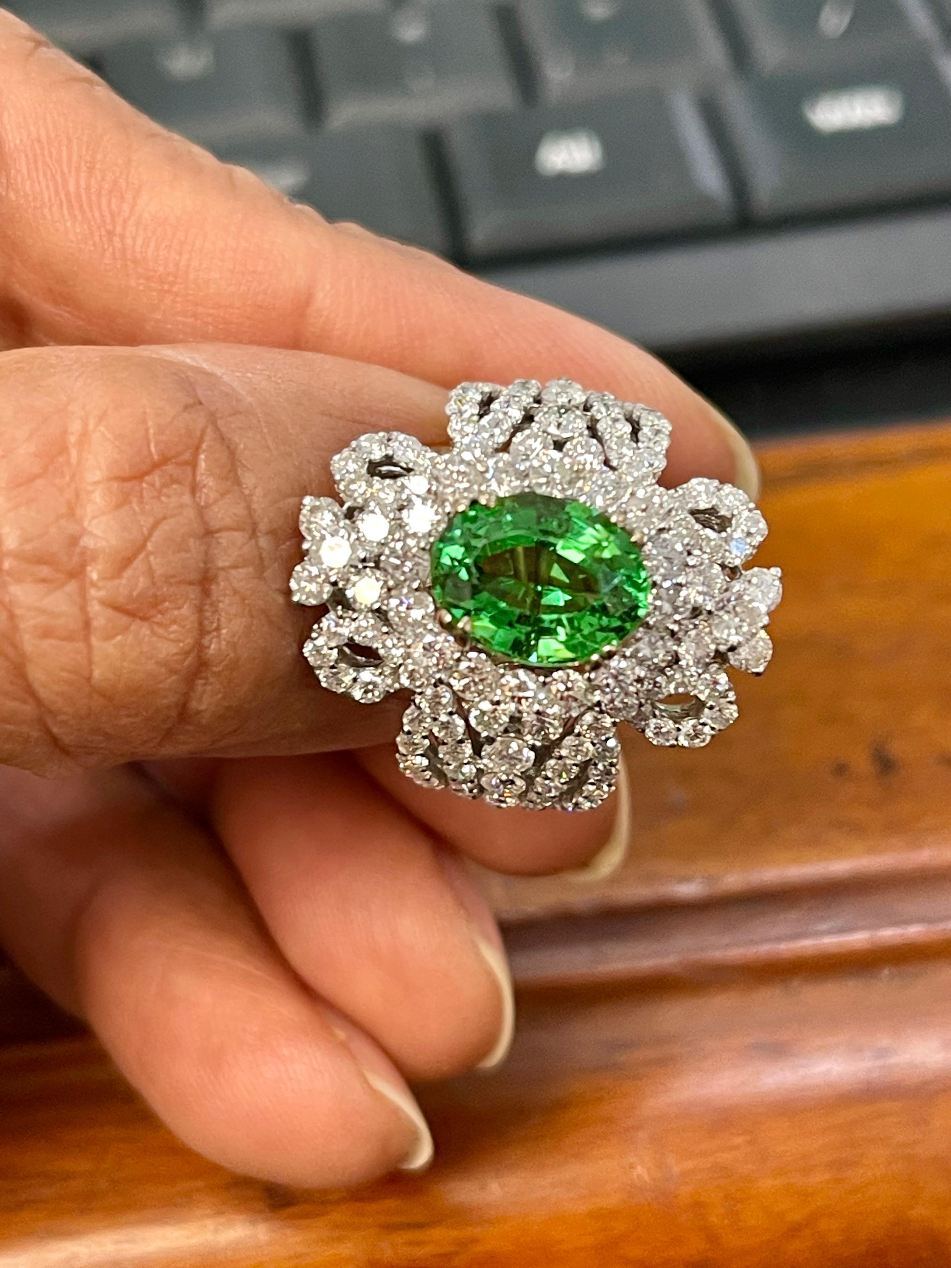 Women's 4 Carat Oval Tsavorite & 2.9 Carat Diamond in 18 Karat White Gold Ring Estate For Sale