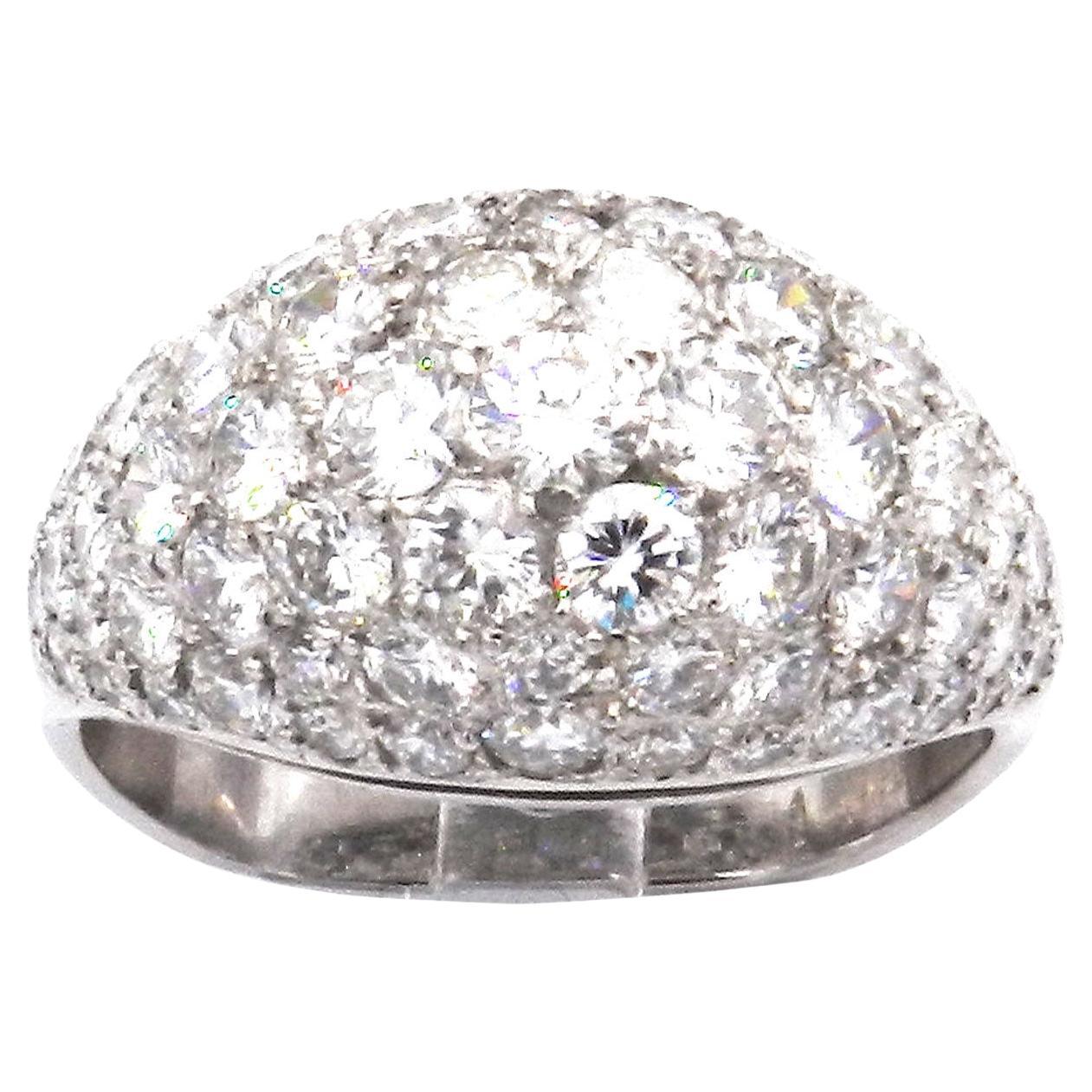 4 Carat Pavé Diamond Cocktail Ring in 18K White Gold

Modern, elegant diamond ring made by hand from 750/18K white gold. The domed display side is set in pavé technique with a total of 81 sparkling diamonds with a total of 4.0 ct GH/VS. To prevent