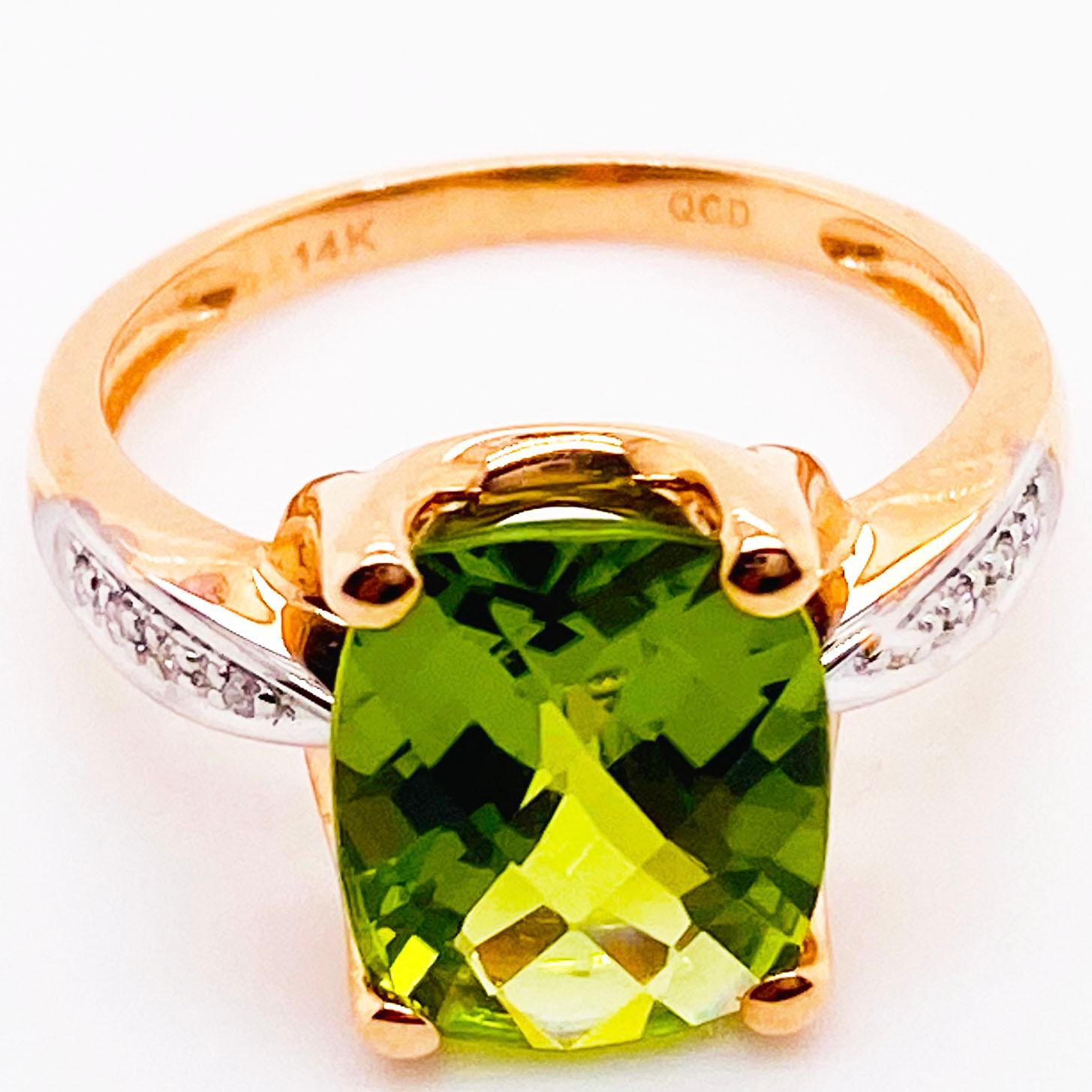 This striking perdiot and diamond ring has a gorgeous antique cushion cut is a beautifully hand cut gemstone with brilliance that showcases the perdiot's natural green colors. The antique cushion shape is an elongating shape that shows brilliance