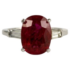 4 Carat Pigeon Blood Ruby and Diamond Three-Stone Ring