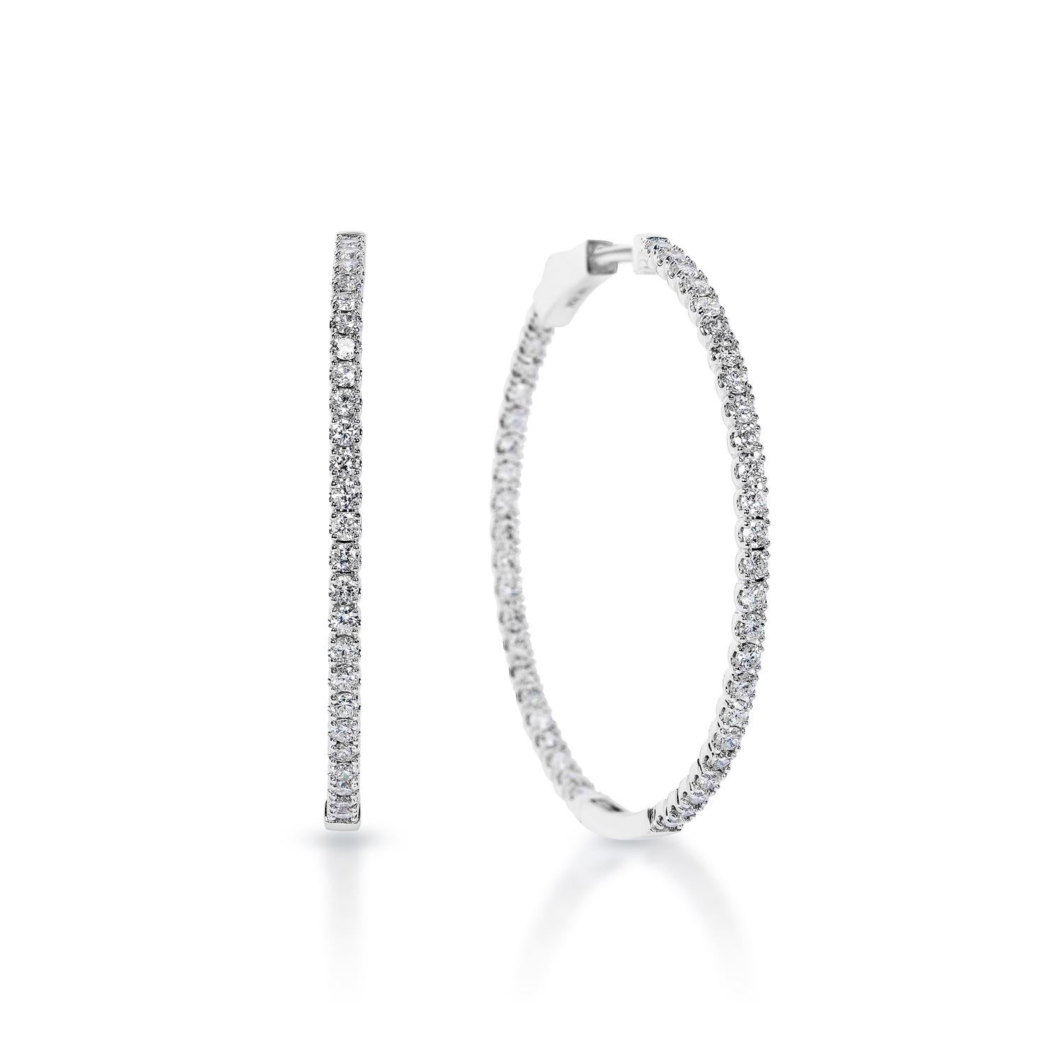 Diamond Hoop Earrings:

Carat Weight: 4.10 Carats
Shape: Round Brilliant Cut
Metal: 14 Karat White Gold
Style: Hoop Earrings