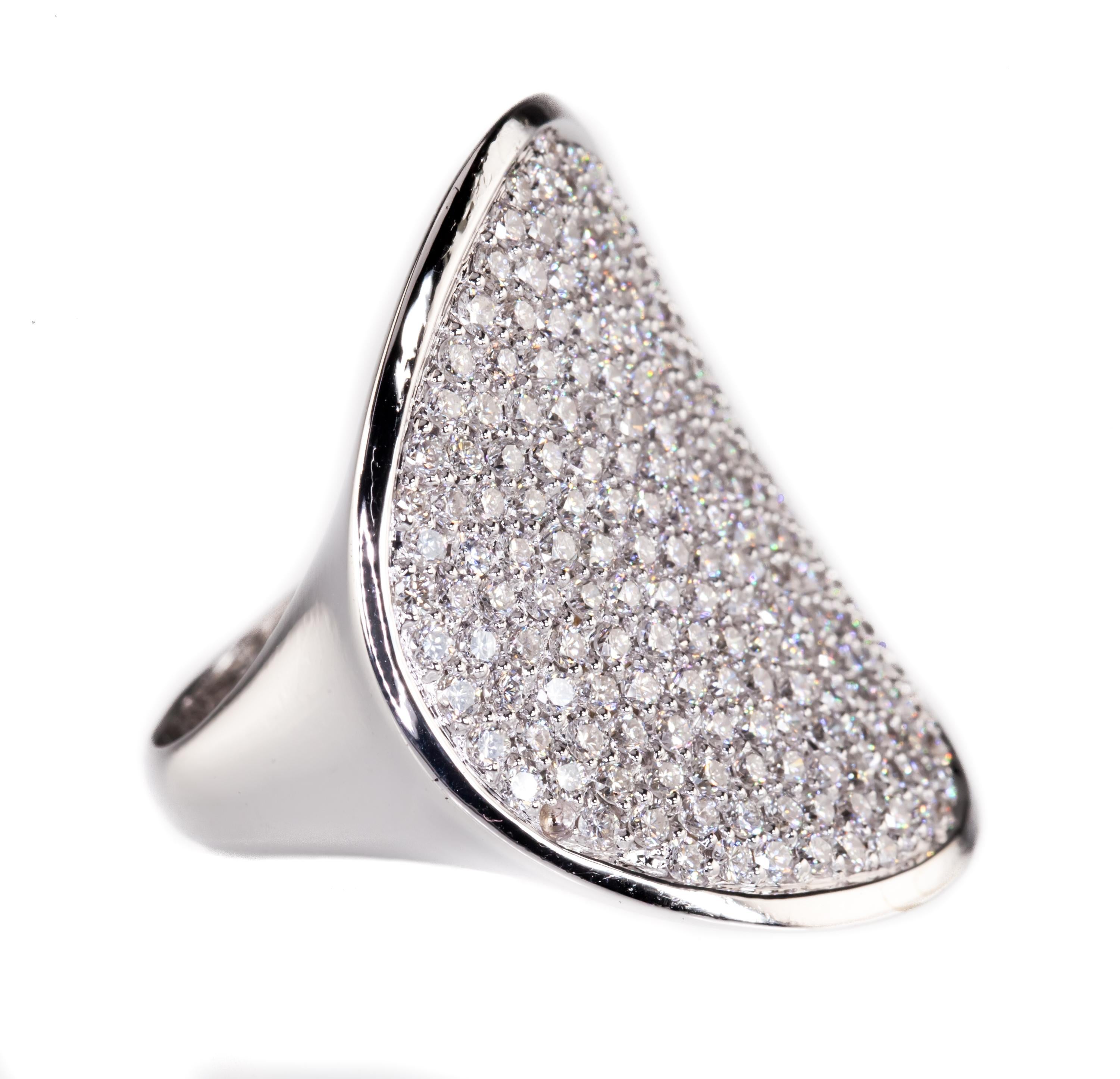 Gorgeous Plaque Diamond Ring
Features Circular Plaque Covered in Round Pave Set Diamonds
Total Diamond Weight = 4.00 Cts
Average Color = F
Average Clarity = VS1
Circle is slighty curved on all sides, creating a hyperbolic paraboloid (pringle)