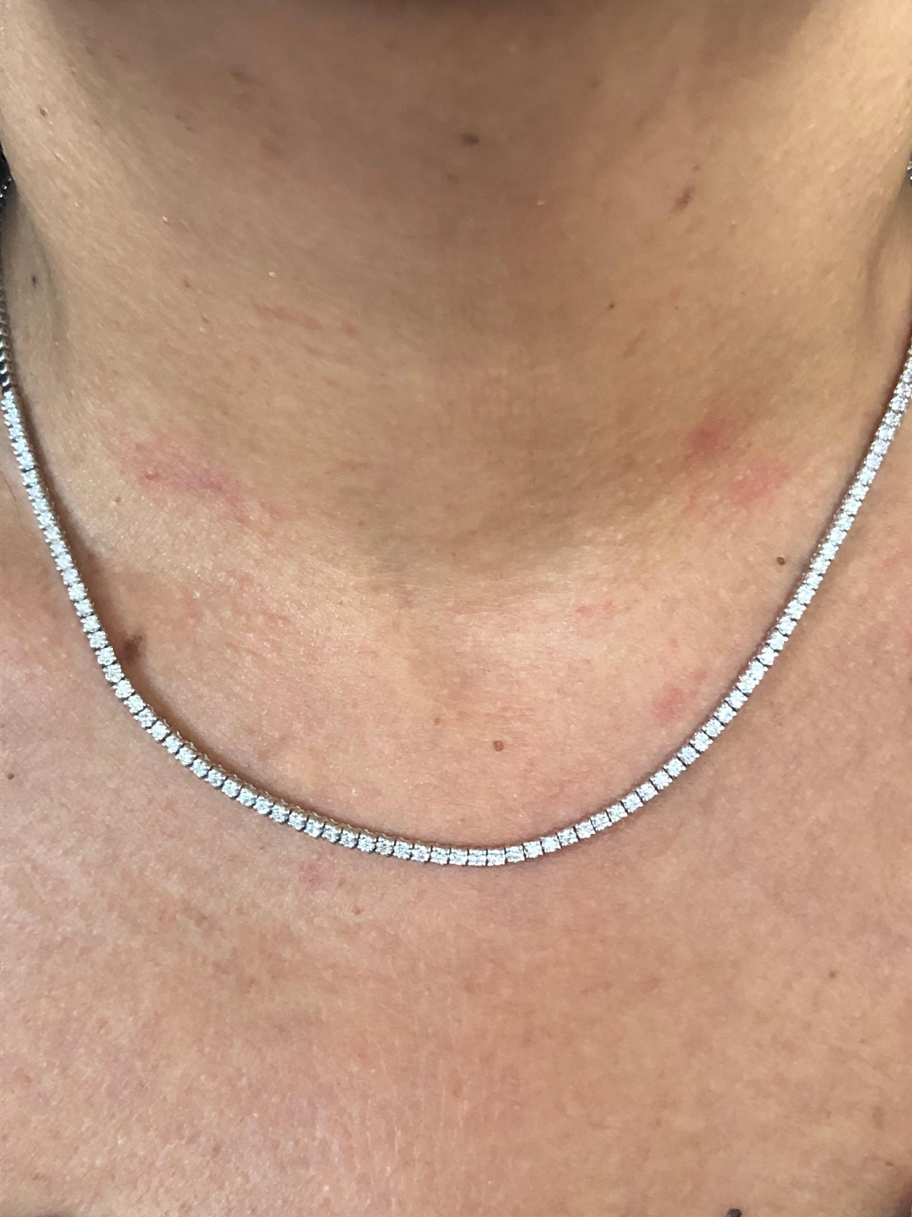 Tennis necklace set with diamonds 3/4 of the way in 14K white gold. Each stone weighs 0.03 carats. The total diamond weight of the necklace is 3.83 carats. The color of the stones are G-H, the clarity is SI1-SI2.  The necklace is measured at 17