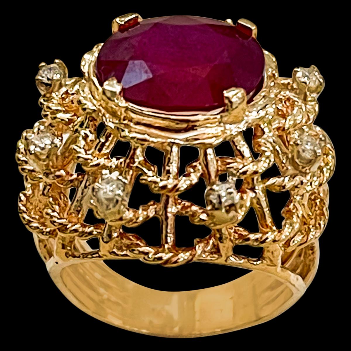 5 Carat Treated Ruby And Diamond 14 Karat Yellow Gold Ring Size 6
 prong set
14 K Yellow Gold: 8.9  gram
Stamped 14K
Ring Size 5 ( can be altered for no charge )
Large 4 carat oval shape ruby Treated surrounded by brilliant cut diamonds .
Diamonds: 