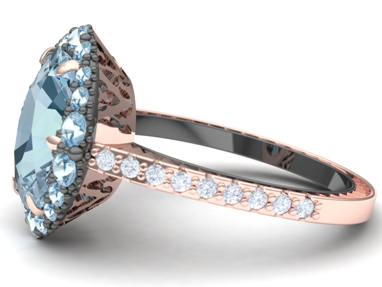 This modern and sleek Aquamarine and diamond ring has a 3.25 carat cushion cut center.  The head is constructed of a 18 k rose gold six talon prongs.  The top of the ring has a mixture of Aqumarine and diamond pave'd in grayed silver.  The shank of