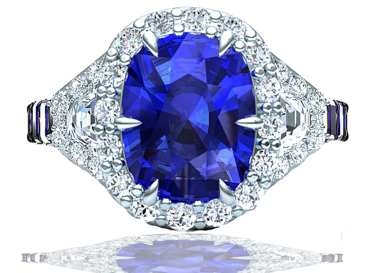 A wonderful ring for evening wear or as an alternative engagement ring.  This ring is versatile in its design and wear ability.  The center stone is a 2 carat cushion blue sapphire that has a gorgeous even blue color and eye clean clarity. The