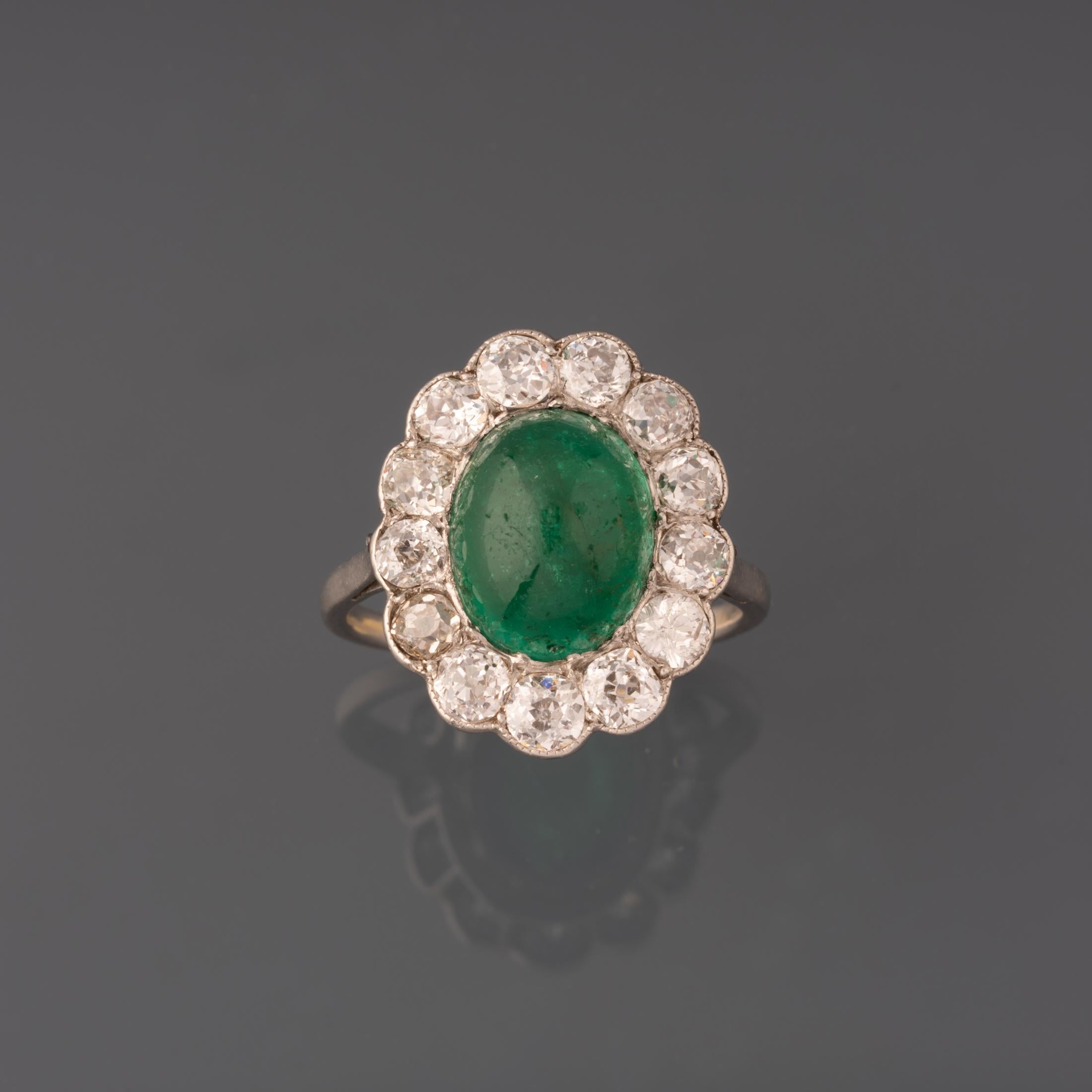 A very beautiful antique ring, made in France circa 1910.

Made in platinum and set with diamonds and an approximately 4 carats emerald cabochon.

The diamonds weights 1.90 Carats approximately (13*0.15).

Dimension of cluster: 20*16mm.

Weight: