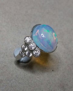 4 Carats Opal Oval Cabochon 14 Kt Gold 12 Full Cut Round Diamonds Cocktail Ring