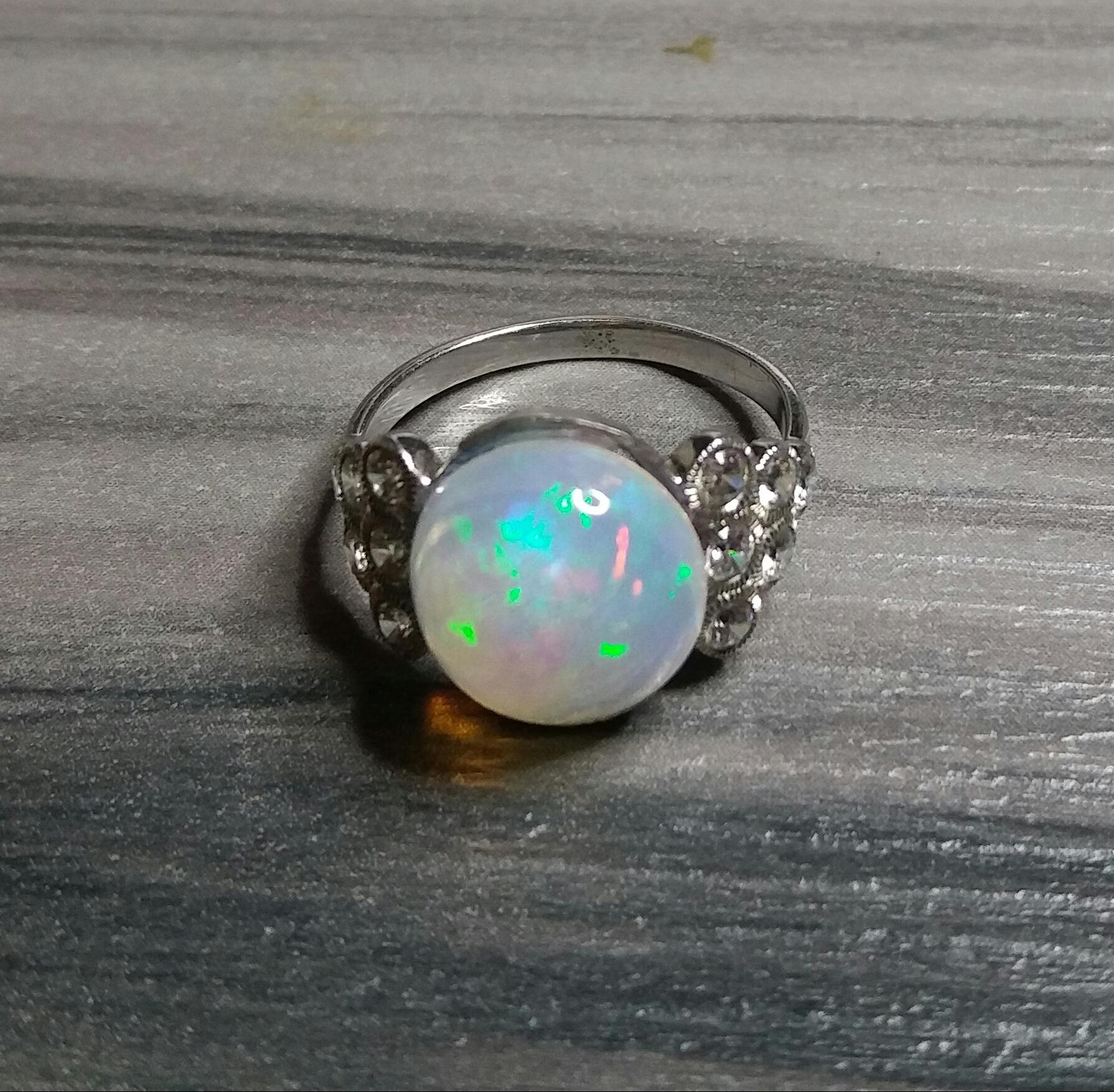 Contemporary 4 Carats Opal Oval Cabochon 14 Kt Gold 12 Full Cut Round Diamonds Cocktail Ring For Sale