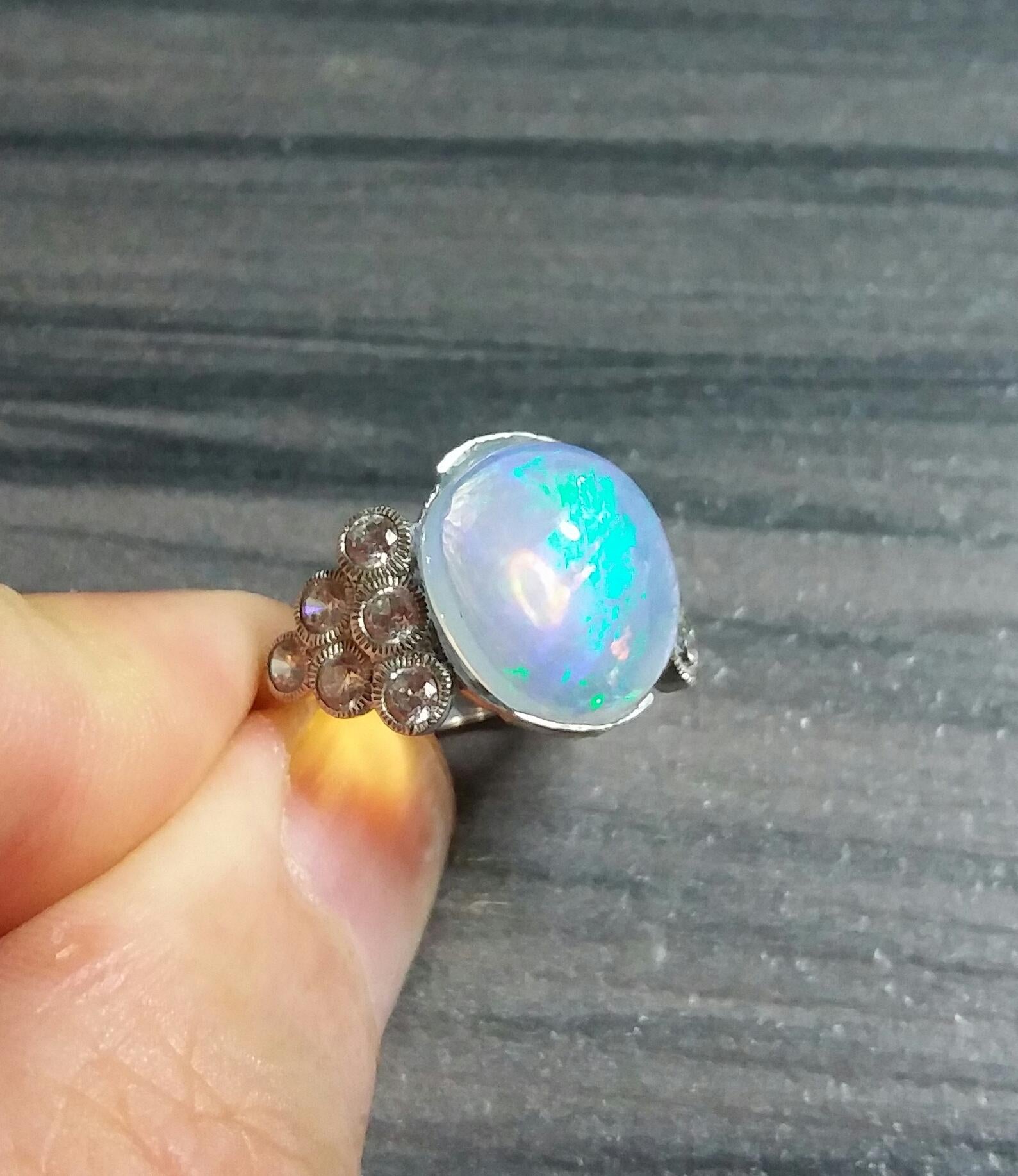 Oval Cut 4 Carats Opal Oval Cabochon 14 Kt Gold 12 Full Cut Round Diamonds Cocktail Ring For Sale