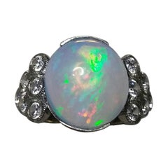 Retro 4 Carats Opal Oval Cabochon 14 Kt Gold 12 Full Cut Round Diamonds Cocktail Ring