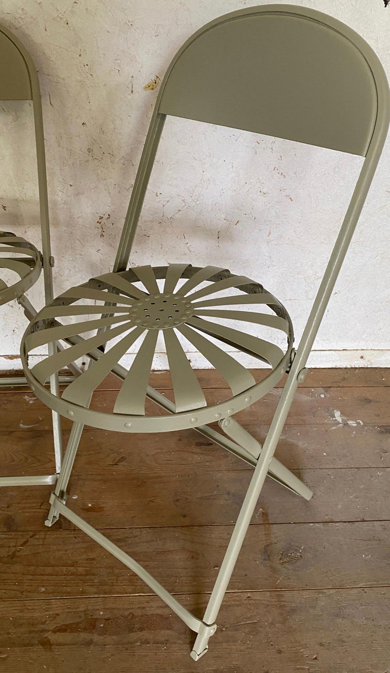 A set of 4 French 1940's Francois Carre sunburst painted folding cafe spring chairs. Great as regular dining chairs or use them as spare chairs when extra seating is needed. Folds up easily for handy storage.
Newly re-painted in a pale French