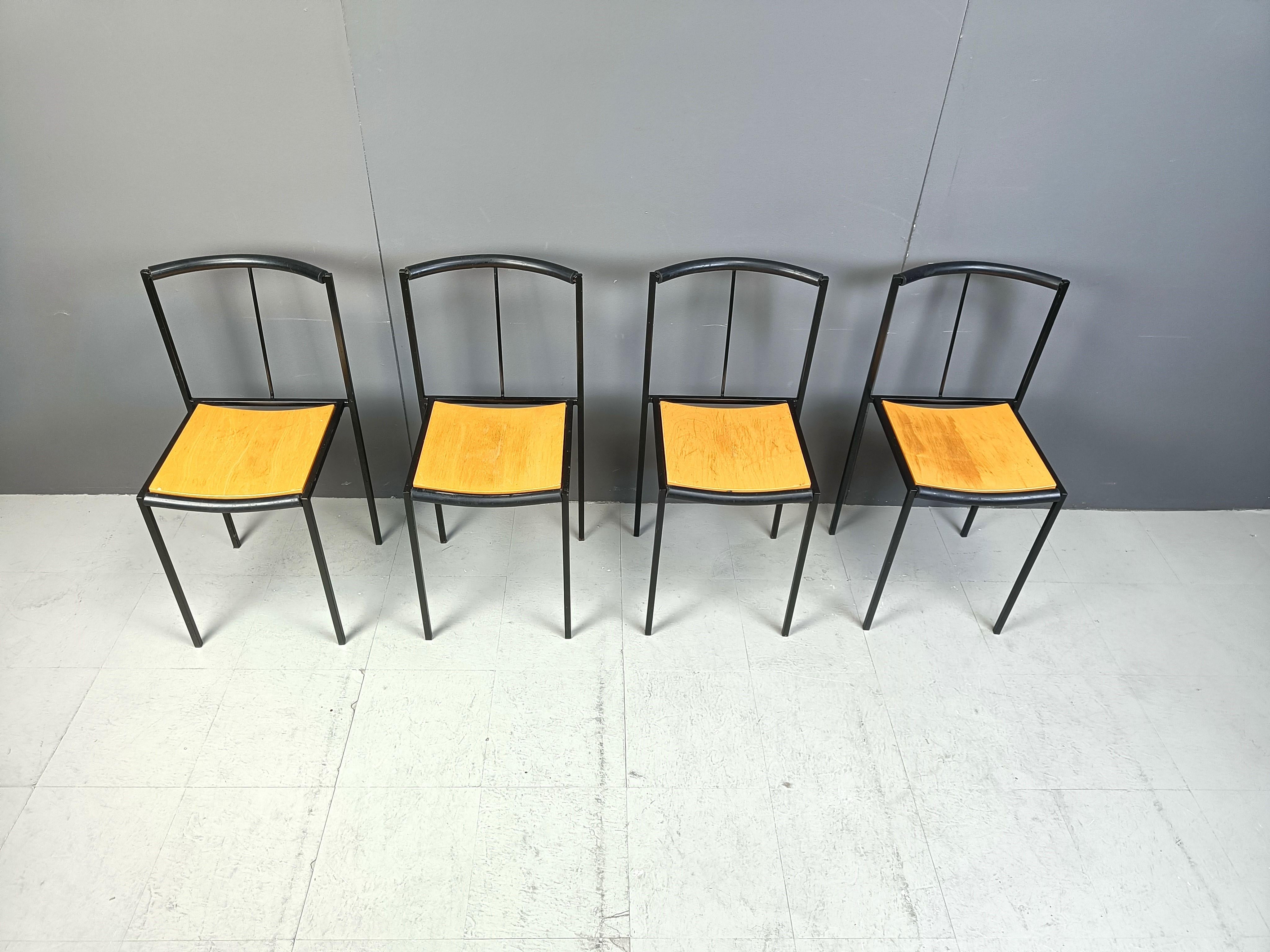 Post modern dining chairs designed by  Sergio Calatroni and Maurizio Peregalli  in 1985 and produced by Zeus Noto

Fine black metal frames and wooden seats.

1985s - Italy

Good condition

Dimensions:
Height: 82cm
Width: 40cm
Depth: 40cm
Seat 