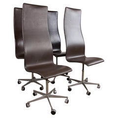 4 chairs, high back, in leather and aluminum, Oxford model by Arne Jacobsen.