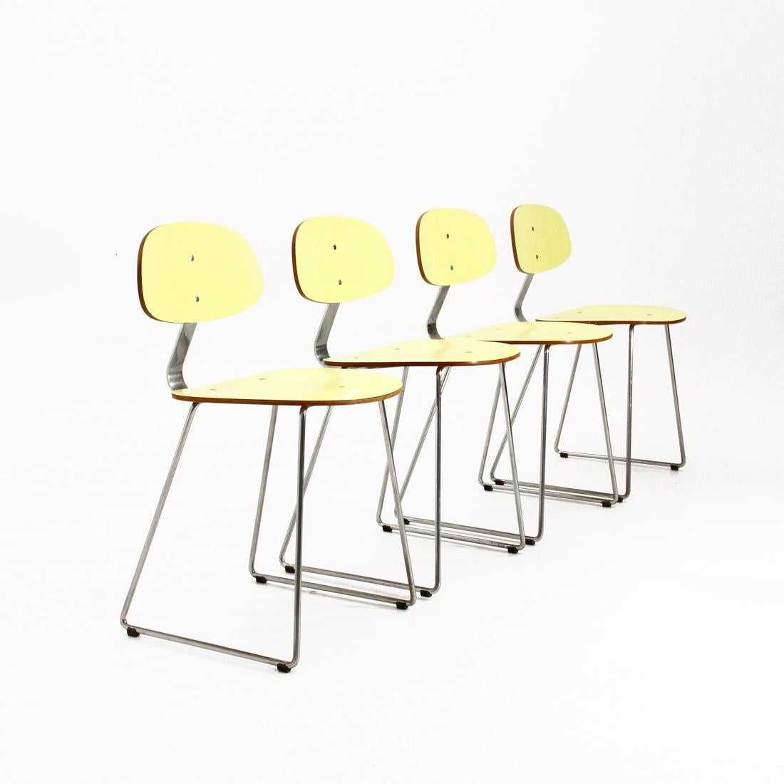4 chairs produced in the 1950s by 3V Arredamenti designed by Georges Coslin.
Chromed metal structure.
Seat and back in curved formica veneered in yellow formica.
Structure in good condition, lack of chrome, signs of rust and some signs of normal