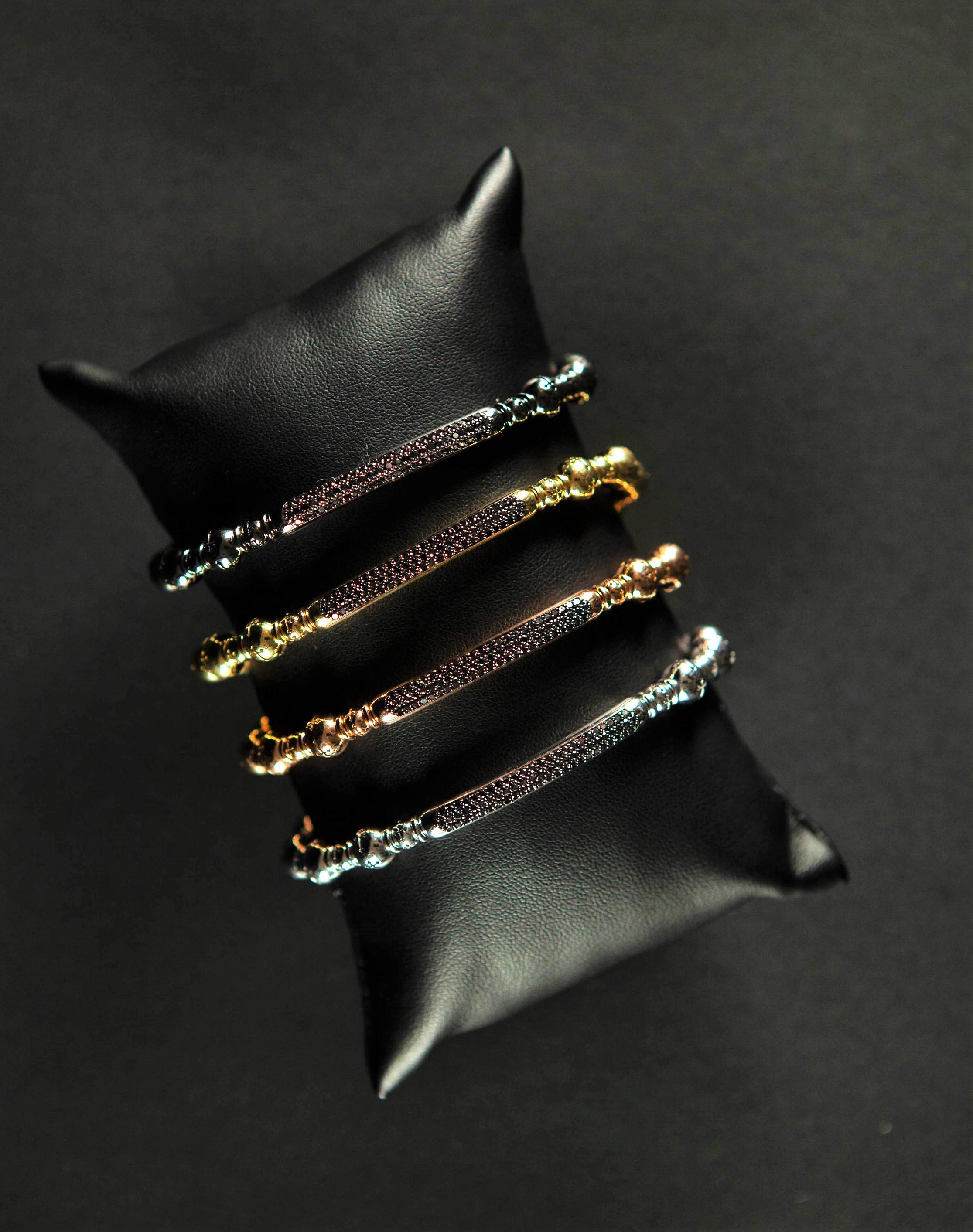 4 wonderful 18k gold beaded bracelets with black diamonds.

Beaded Bracelets with titanium ultra resistent spring to wear them easily without risks of breaking it. 

Each bead is beautifully fret worked and detailed. Wonderful overall effect. 

1
