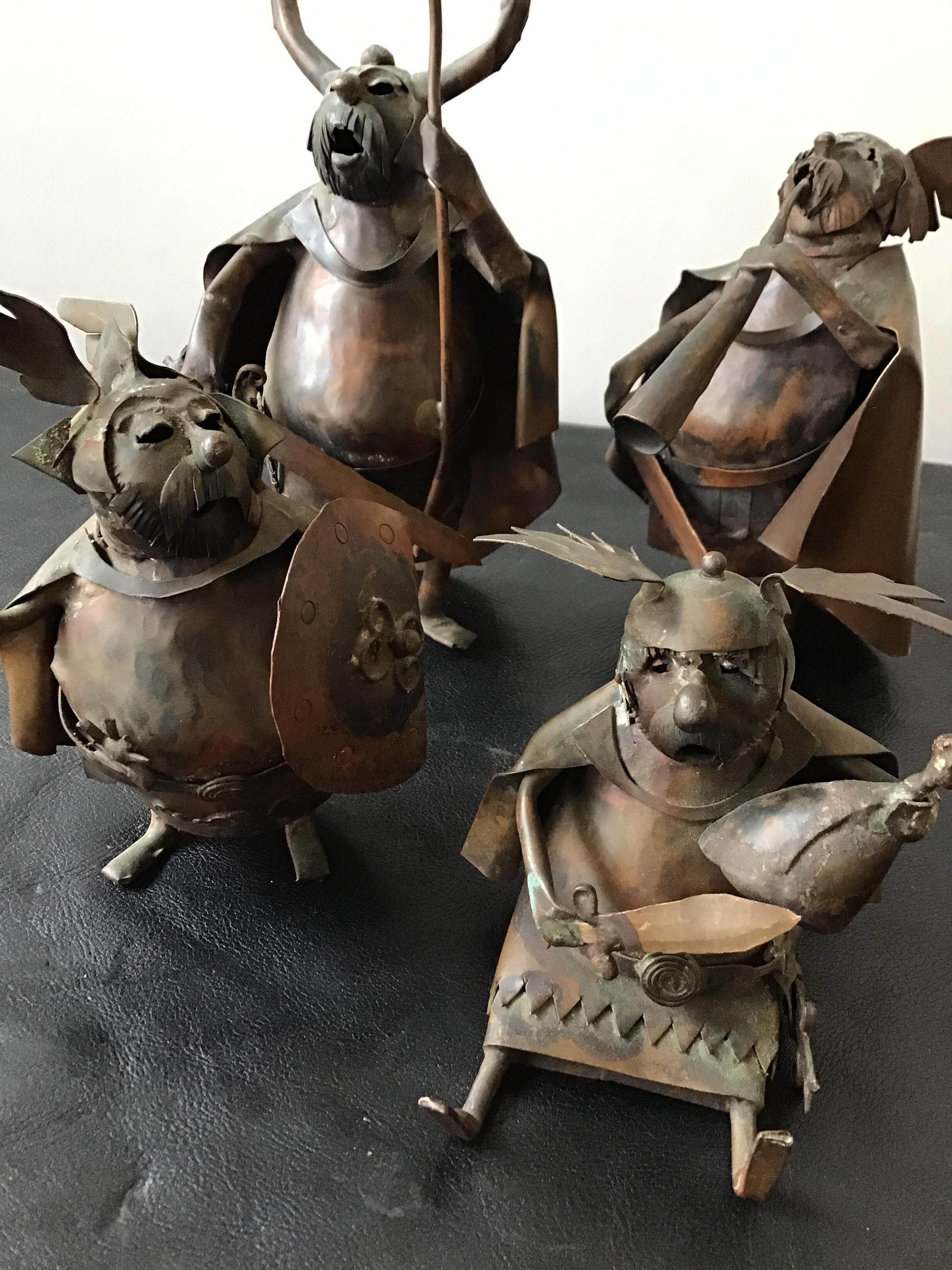 A set of 4, 1960s signed copper Viking statues. Great quality.