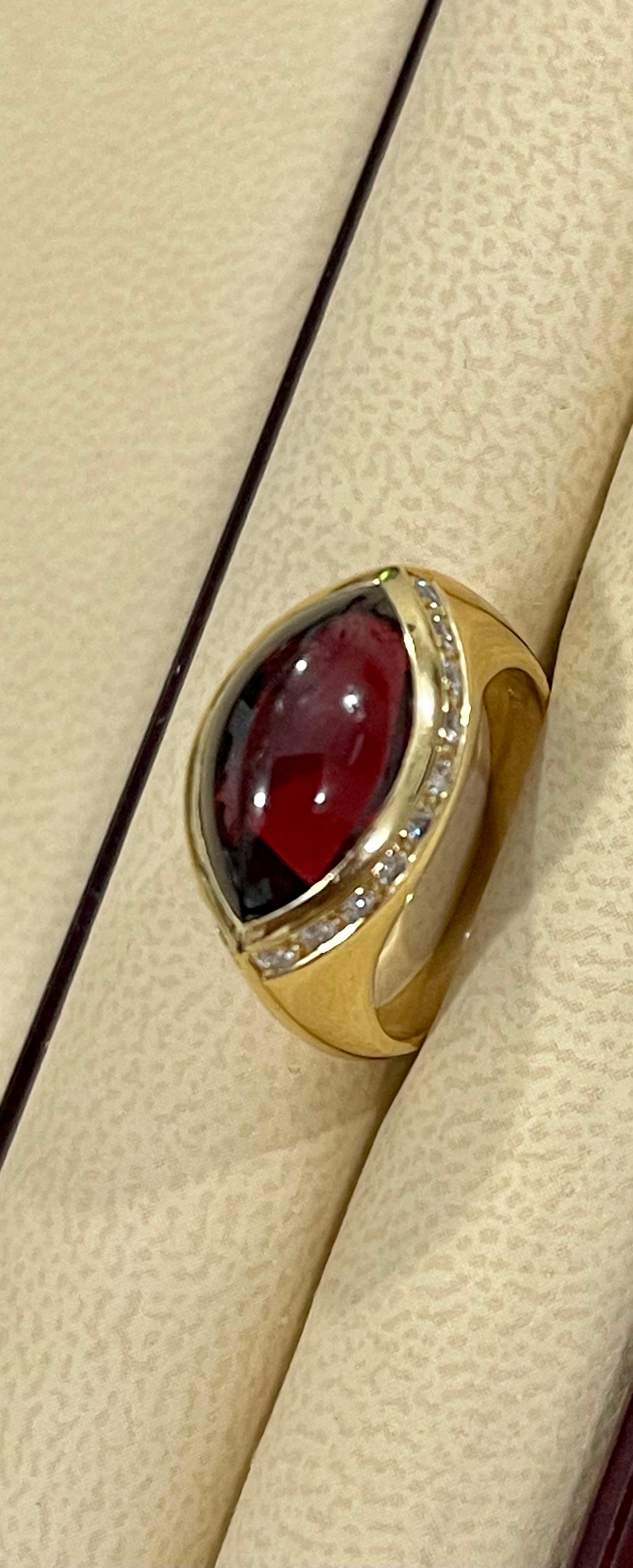 Marquise Shape Rhodolite Garnet and  Diamond Ring 18 Karat  Yellow Gold, Estate , size 6
This spectacular Ring consisting of a single Marquise  Shape High quality Rhodolite Garnet approximately 4 Carat.  The  Garnet ring has approximately 0.75 ct of