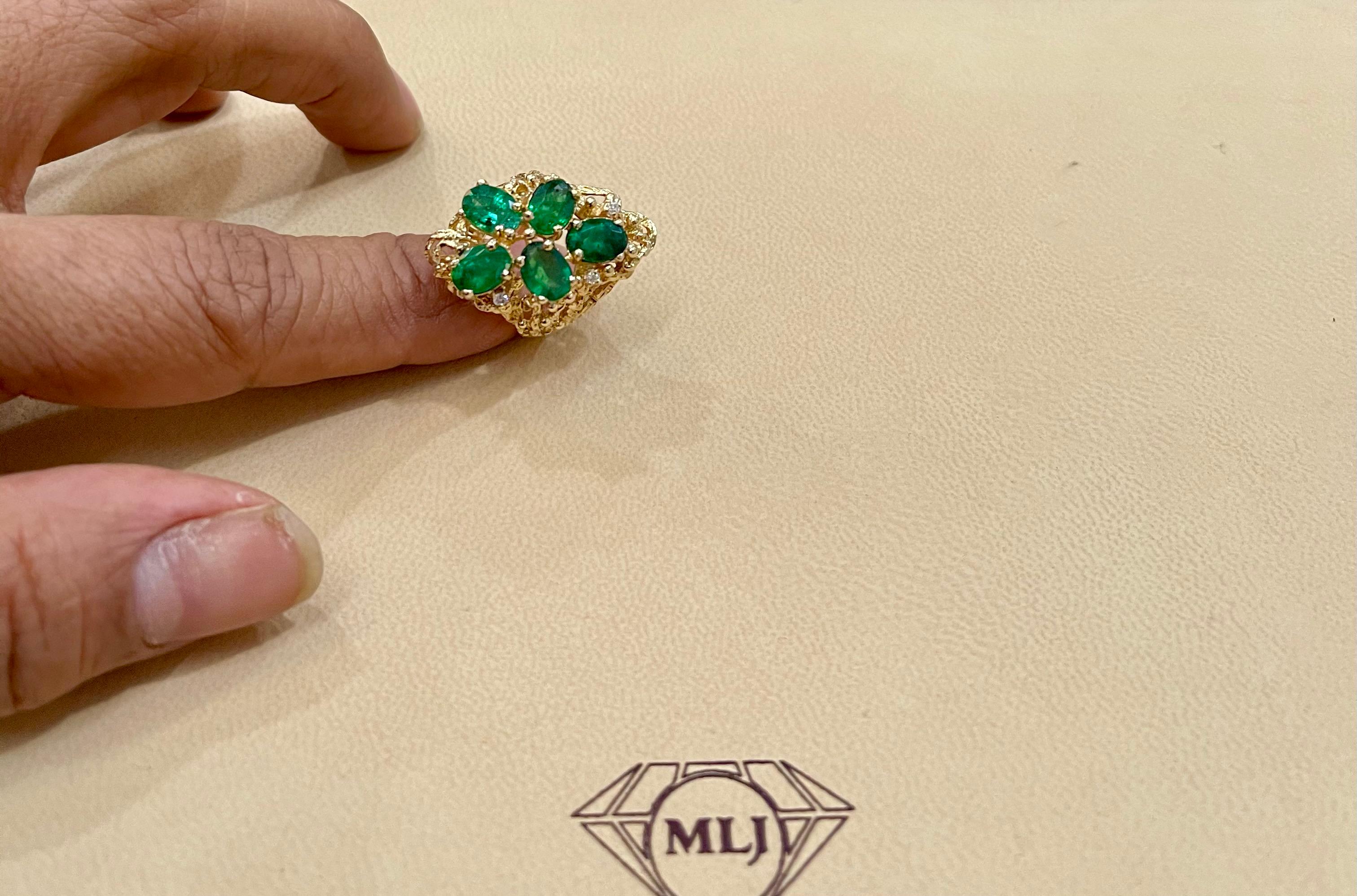 
4 Ct Natural Brazilian Emerald And Diamond Five Stone Ring 14 Karat Yellow  Gold Size 6.5
Oval Shape  Emerald Ring 
 There are Five Natural  fine quality  Oval shape emerald stones with tiny diamonds in between.
Total weight of the emeralds