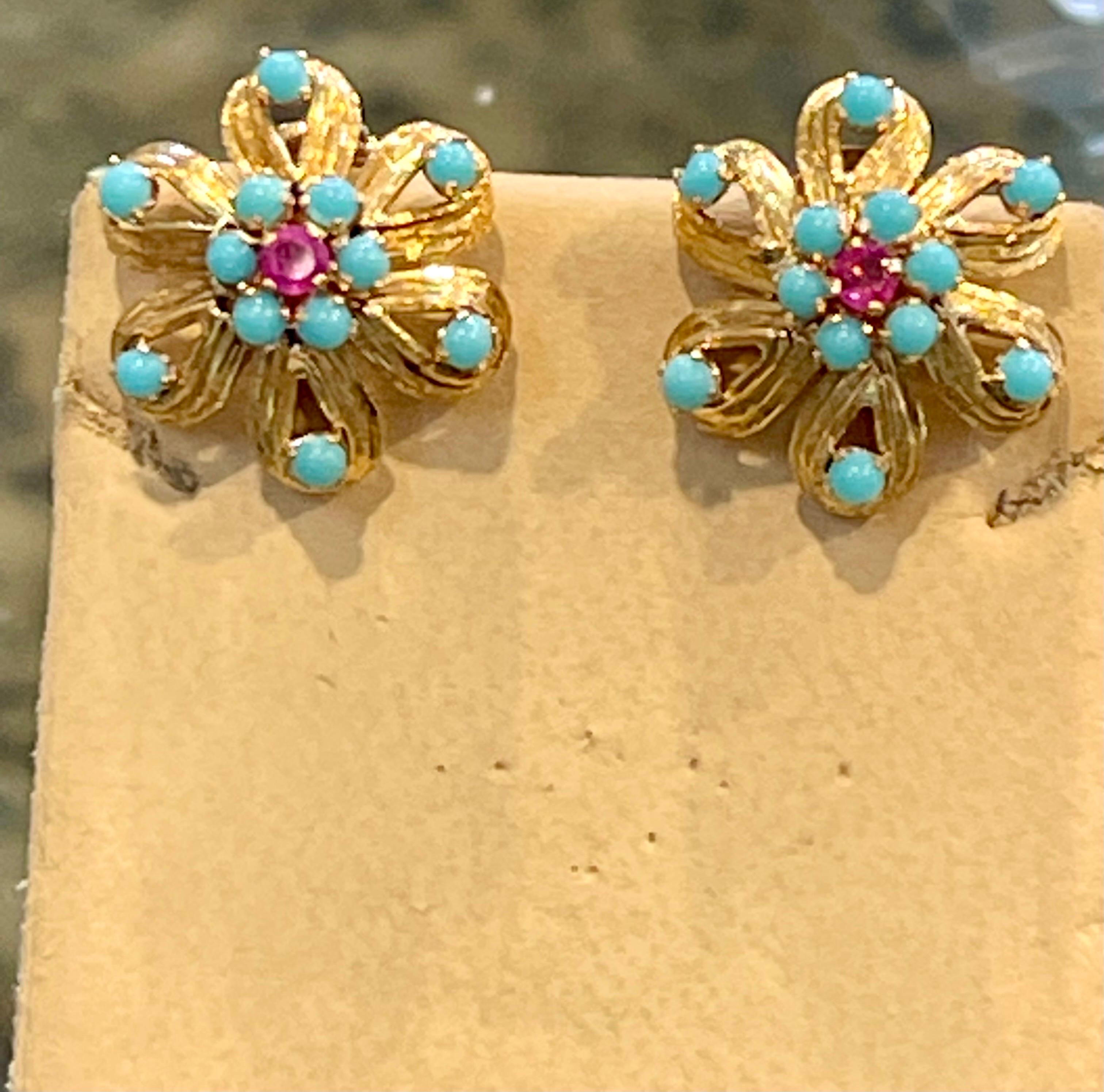 A beautiful suite of Ring and Earring
Approximately 4 Ct Natural Turquoise & Ruby 18 Karat  Yellow Gold Flower Ring & Earring Set 20Gm
 All round Turquoise beads
18 Karat Yellow Gold: 20 Grams
Checked for 18 Karat gold
Ring Size 8  ( can be altered