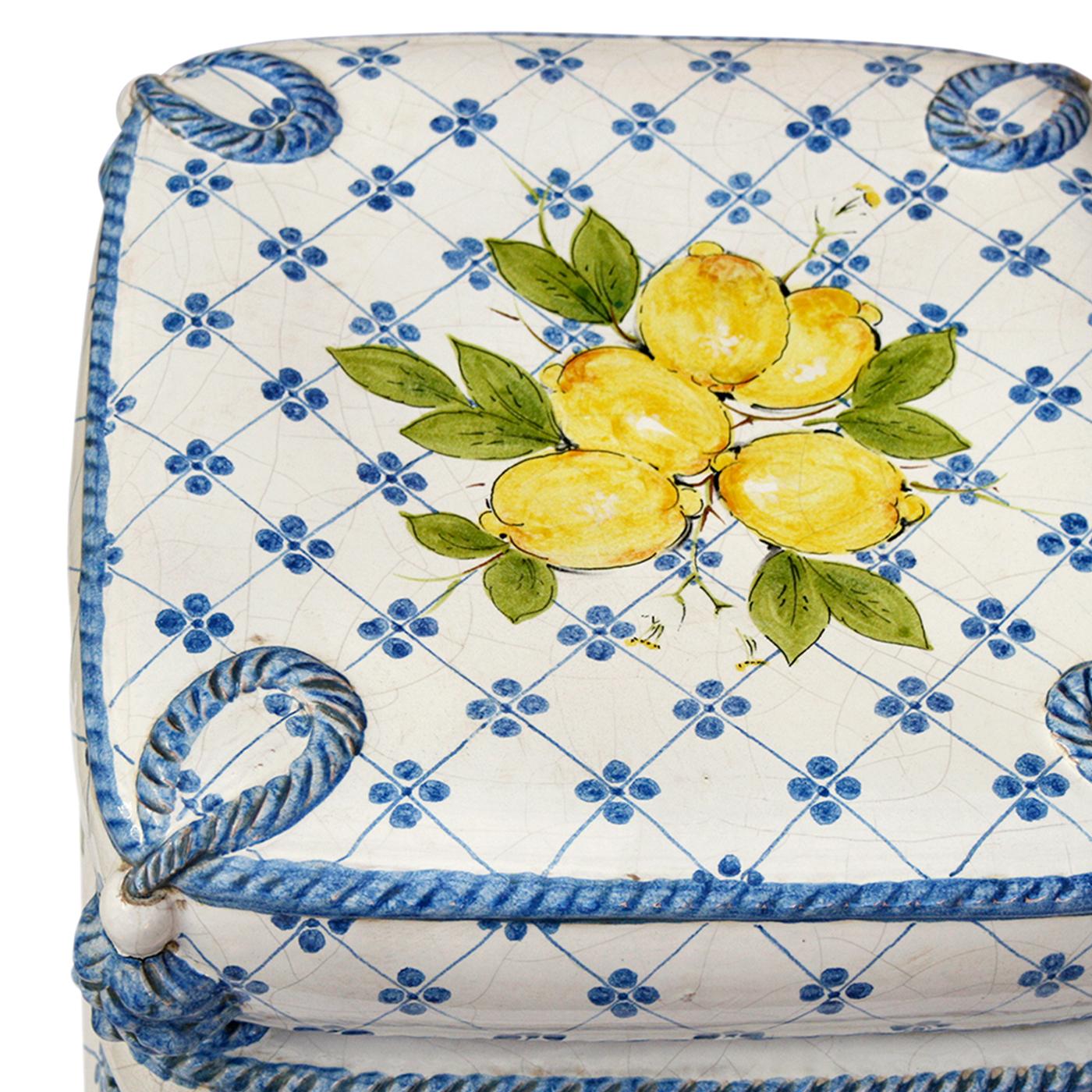 An unassuming yet sublime design, this sculpture is composed of four handcrafted ceramic cushions that can also make up for a precious and delicate stool. Superbly and minutely painted by hand in a stunning Mediterranean-inspired motif rendered in
