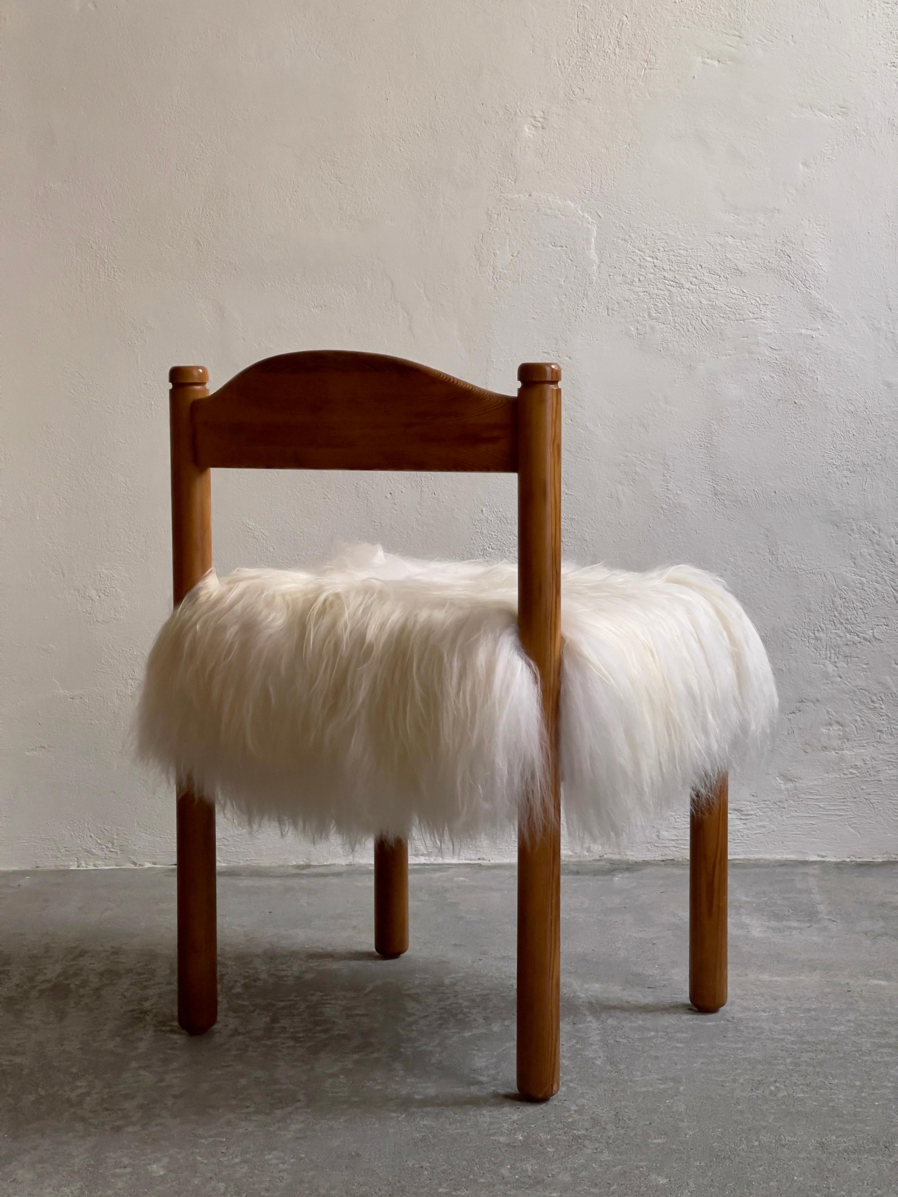 Four dining chairs in pine reupholstered in long haired sheepskin. Denmark 1970s For Sale 2