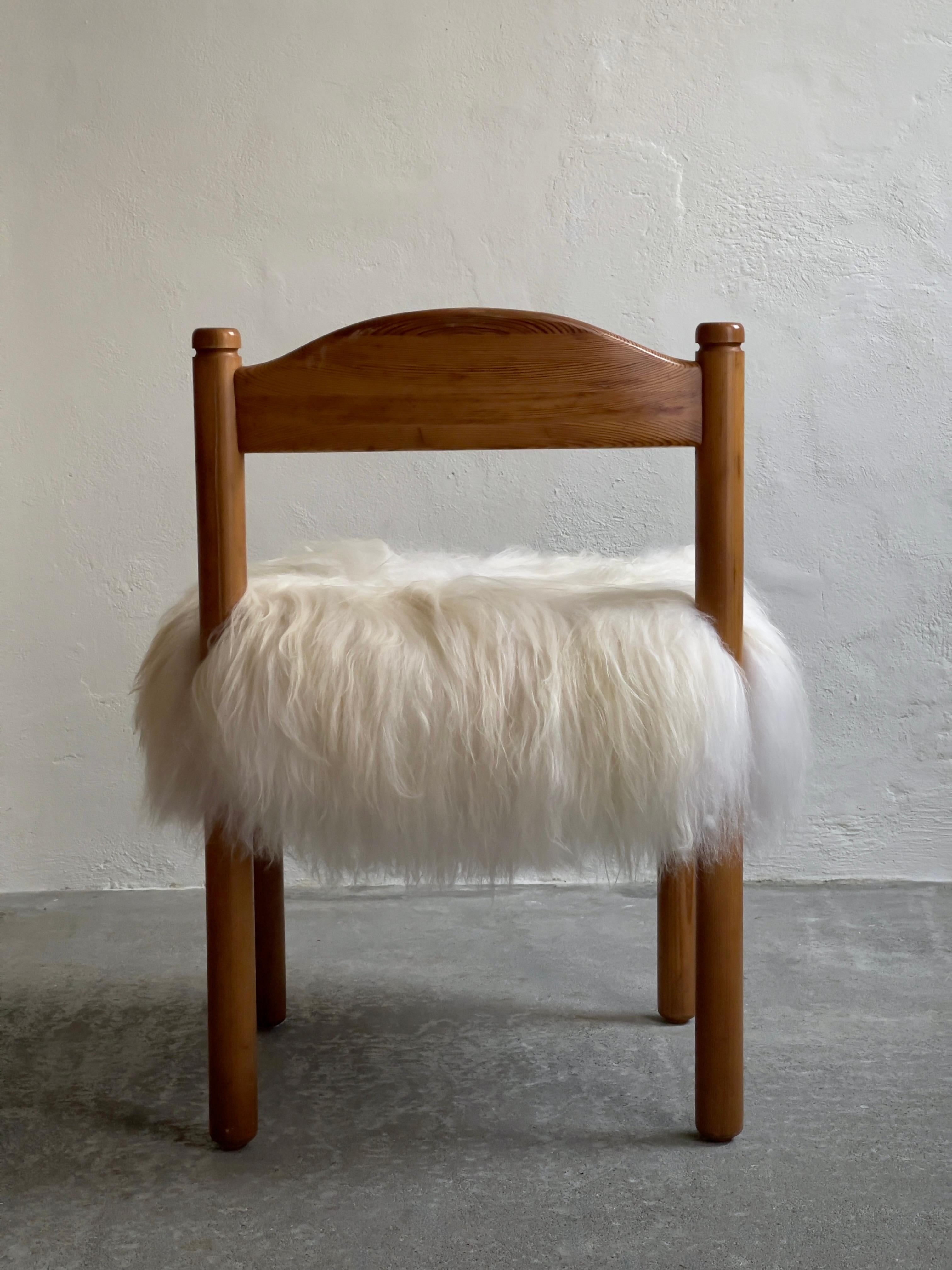 Danish Four dining chairs in pine reupholstered in long haired sheepskin. Denmark 1970s For Sale