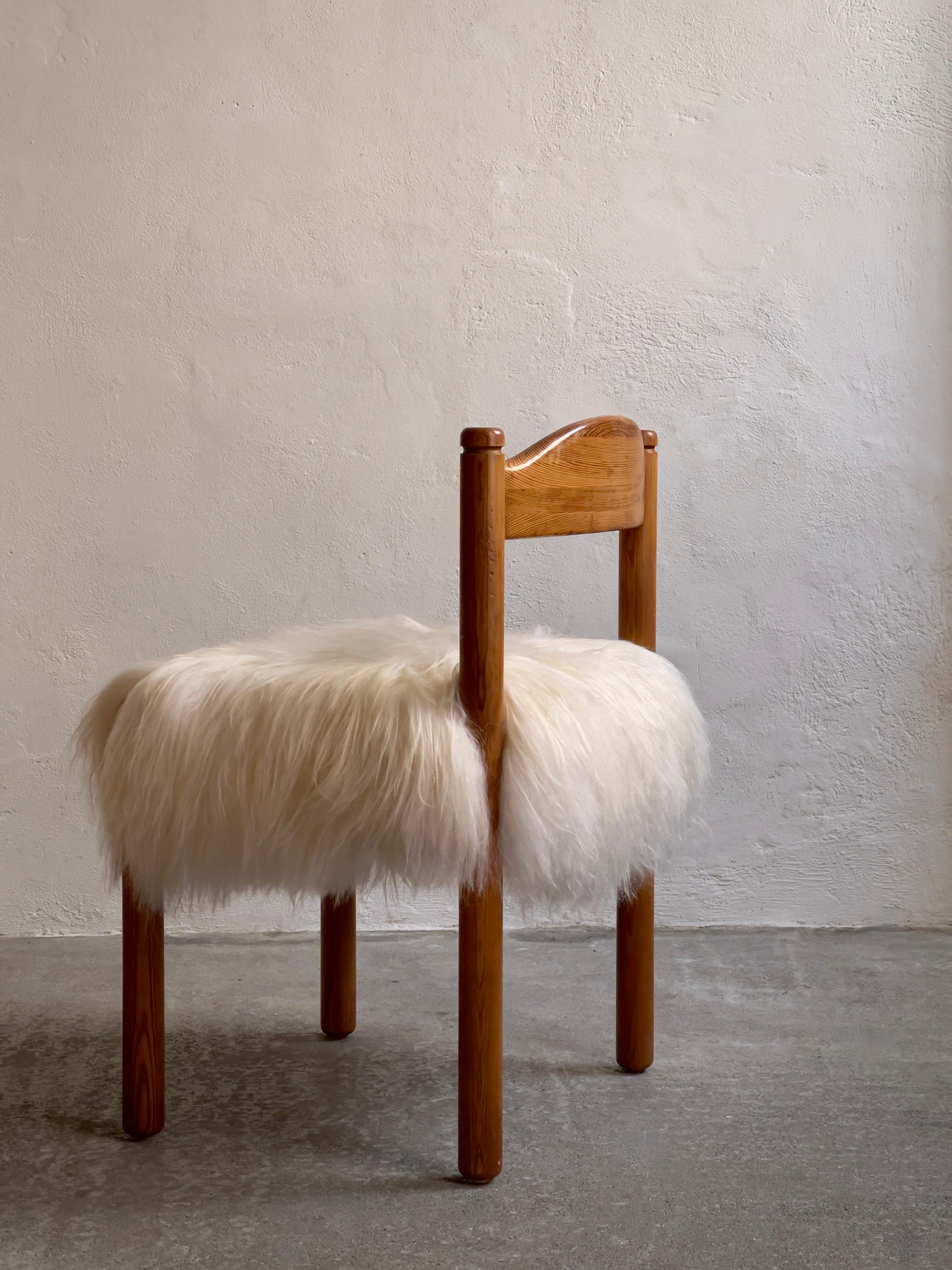 Four dining chairs in pine reupholstered in long haired sheepskin. Denmark 1970s For Sale 1