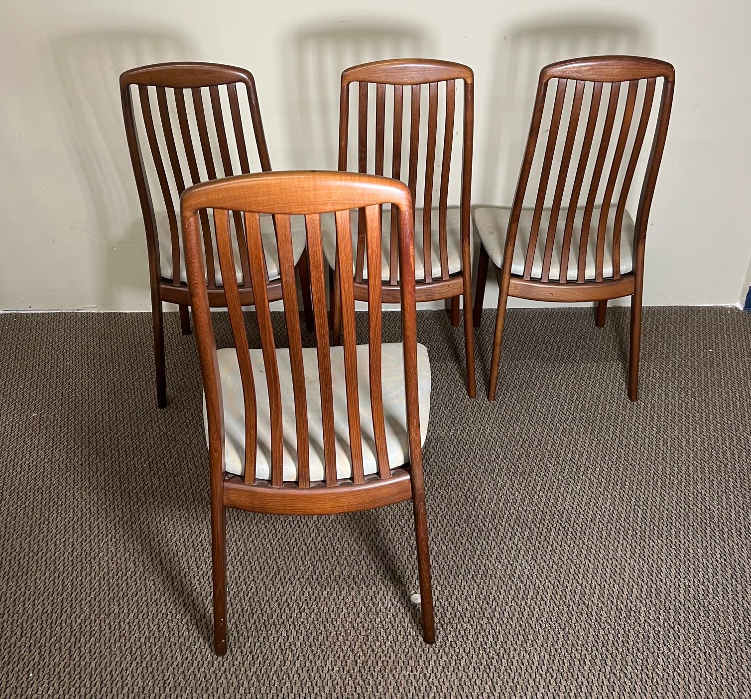Set of 4 mahogany dining chairs by Schou Andersen. Made in Denmark. 
Very good condition. Minor marks on the teak frames. Very sturdy. Upholstery faded and not original. Could easily be reupholstered to match your decor.

Dimensions: 19.5