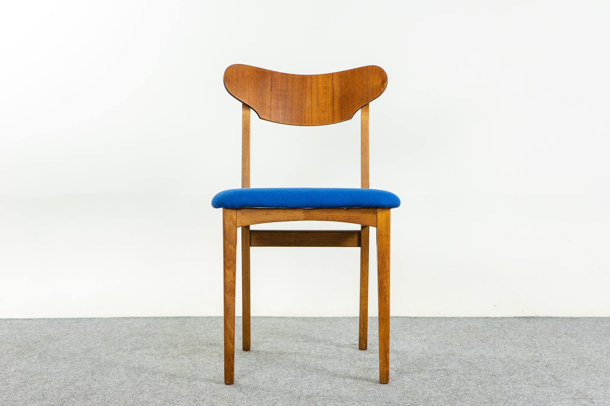 Teak & oak Danish dining chairs, circa 1960's. Beautifully curved teak backrests with unique shape, generous seat provides support and comfort. Solid oak frame with cross braces, for stability and support. Vibrant blue wool upholstery in great