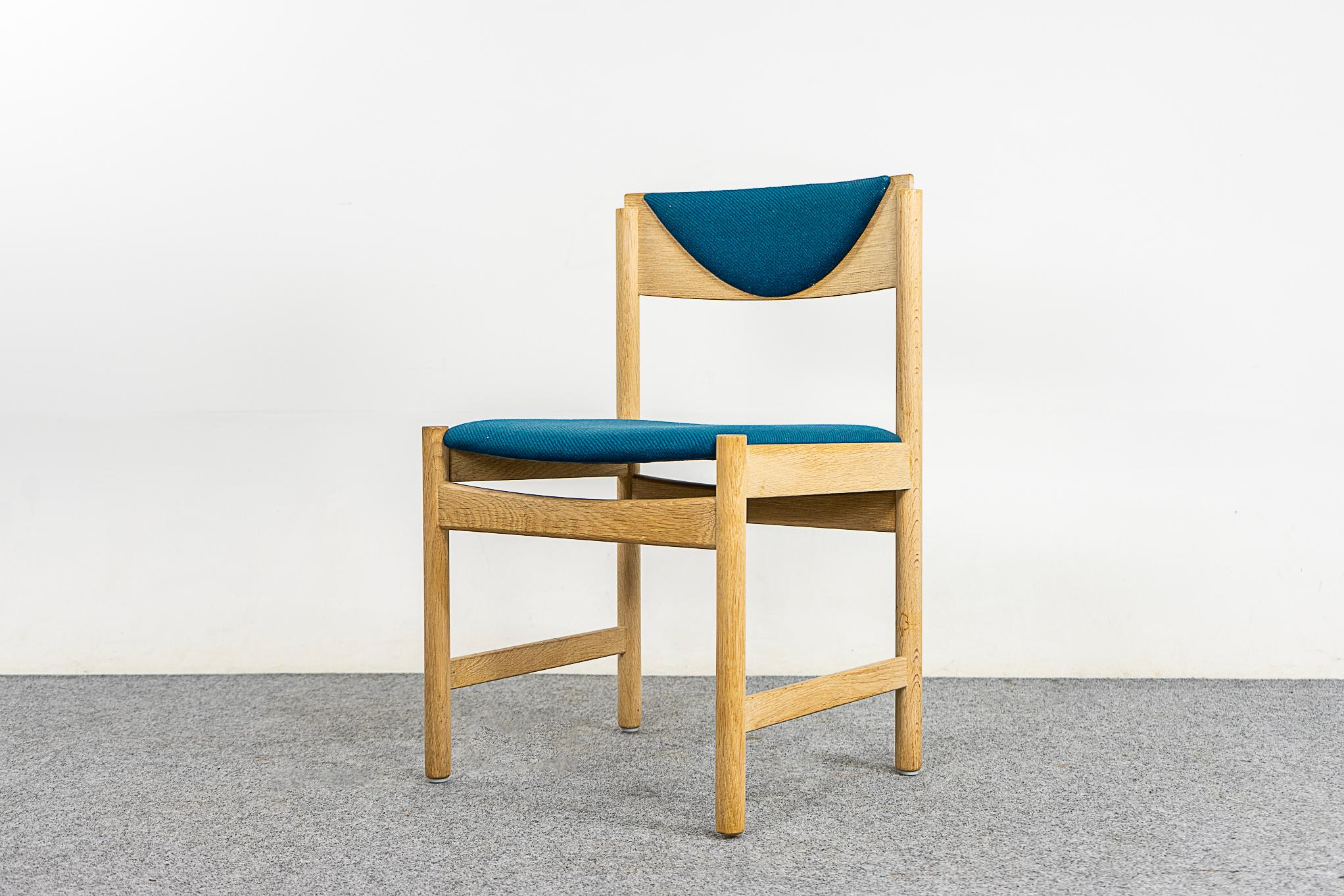 Oak dining chairs, circa 1960's. Beautifully curved backrests and generous seat. Solid legs feature cross braces for stability/support. Curved half moon original upholstered backrests, with minor wear. Very unique!

Please inquire for international