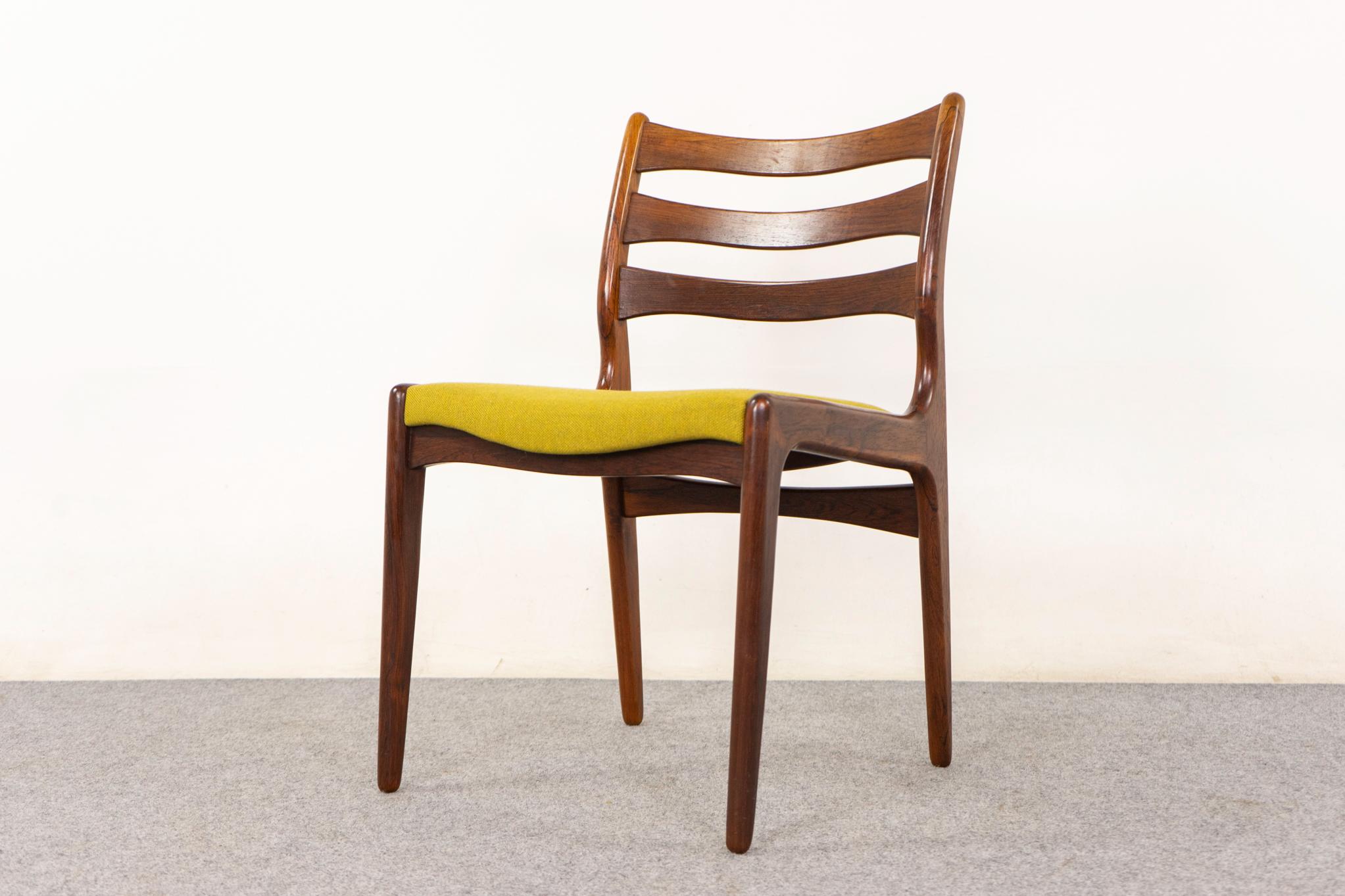 Set of 4 Danish rosewood dining chairs, circa 1960's. Stunning grain patterns, comfortable bowtie ladder back design with elegantly curved frame. New quality lemon/lime upholstery in a blend of wool and flax.