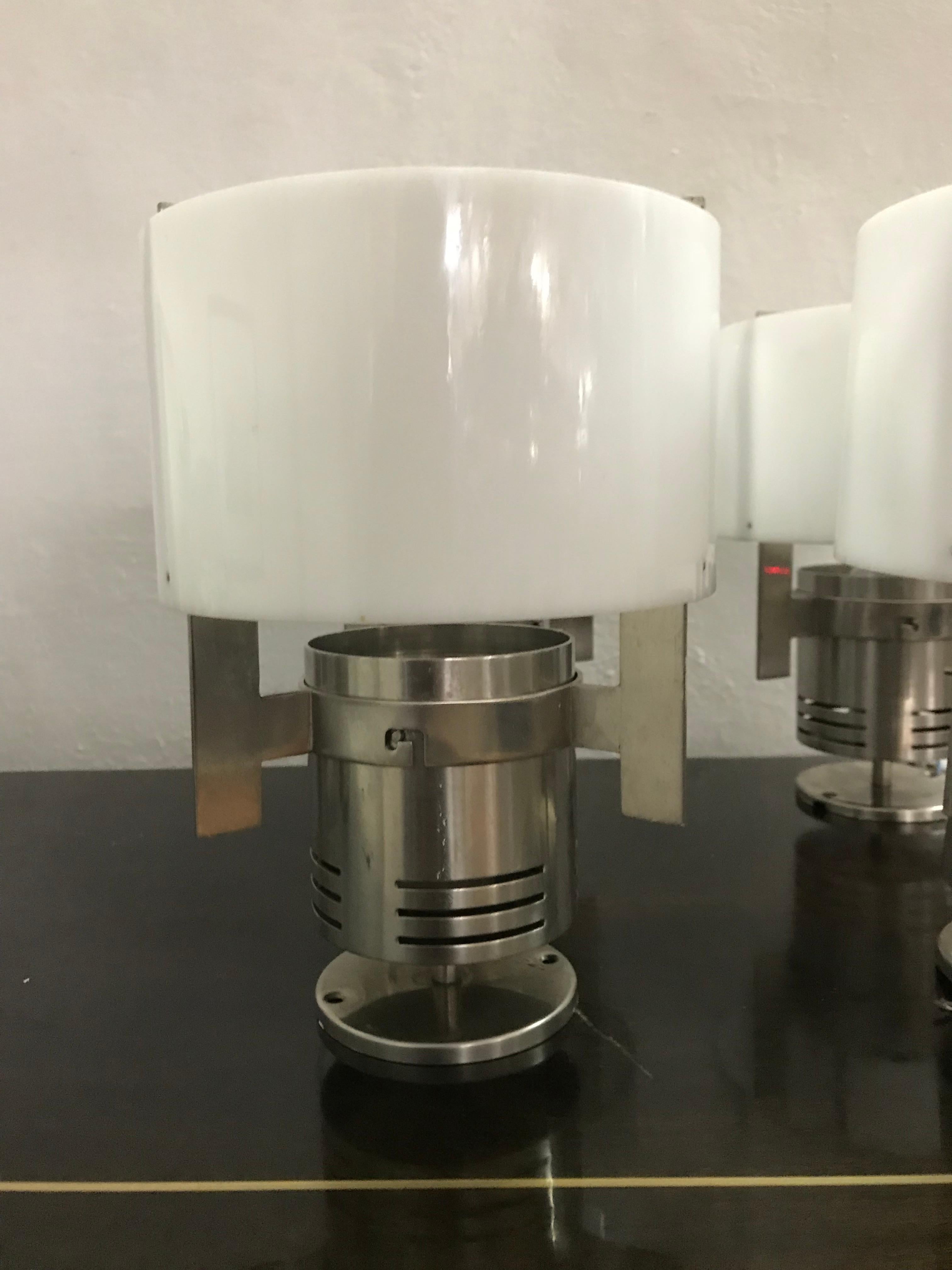 Mid-Century Modern flush mounts in the manner of Fog & Mørup in stainless steel and white plexi glass.
Scandinavian modern design.
circa 1970
Priced Individually.