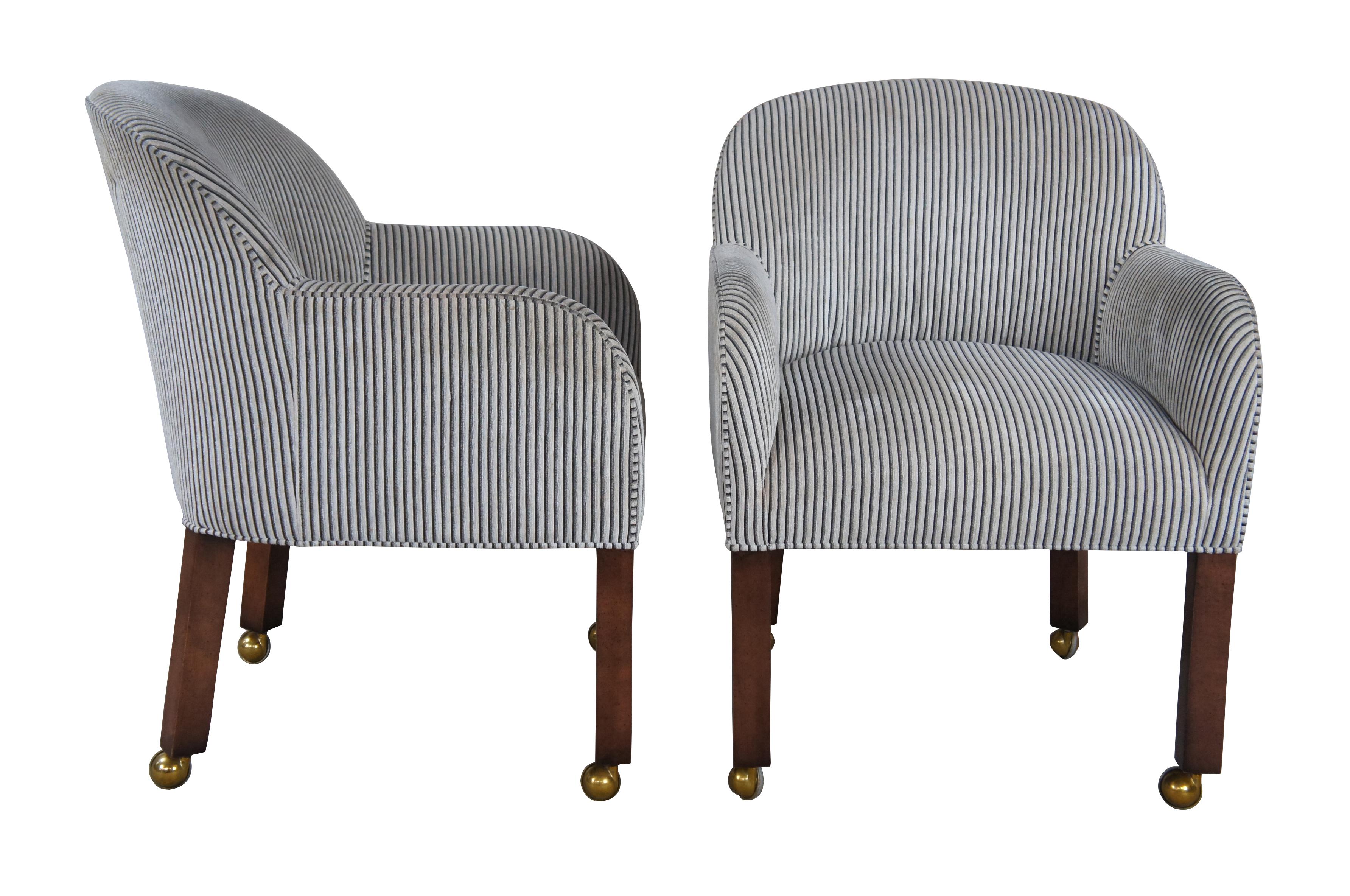 Designmaster for Globe Furniture Laurel Tub Chair; 01-197. The design is similar to a game chair; however, the seat height and depth is all dining chair specific. The exposed wood legs are maple with a cherry finish. Upholstered in a neutral striped