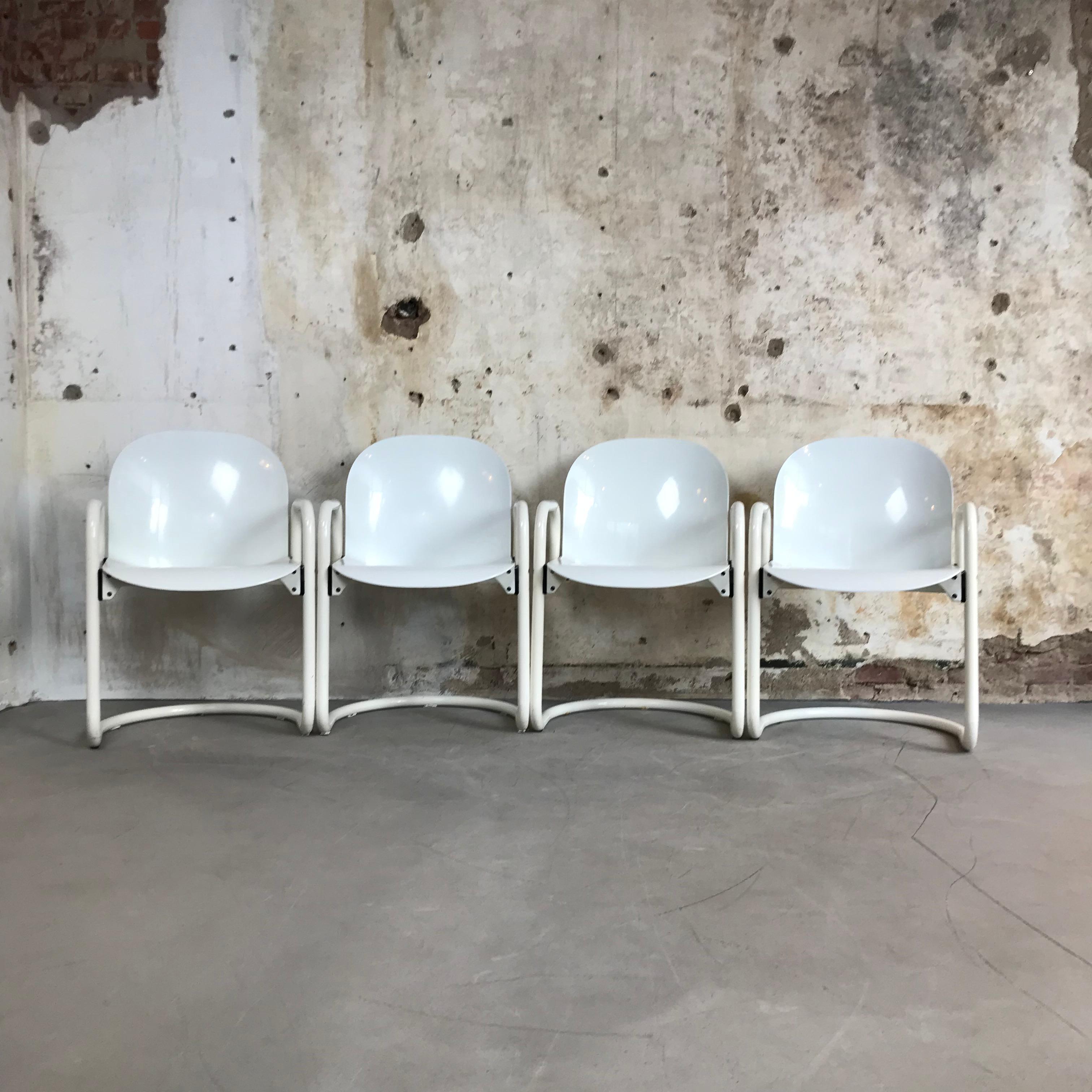 Set of four 'Dialogo' dining chairs by Tobia & Afra Scarpa for B&B Italia, circa 1970, Italy.
Very comfortable chairs with seat and back in molded (ABS) plastic with a nice glossy finish.
Structure in very good condition, some little signs due to