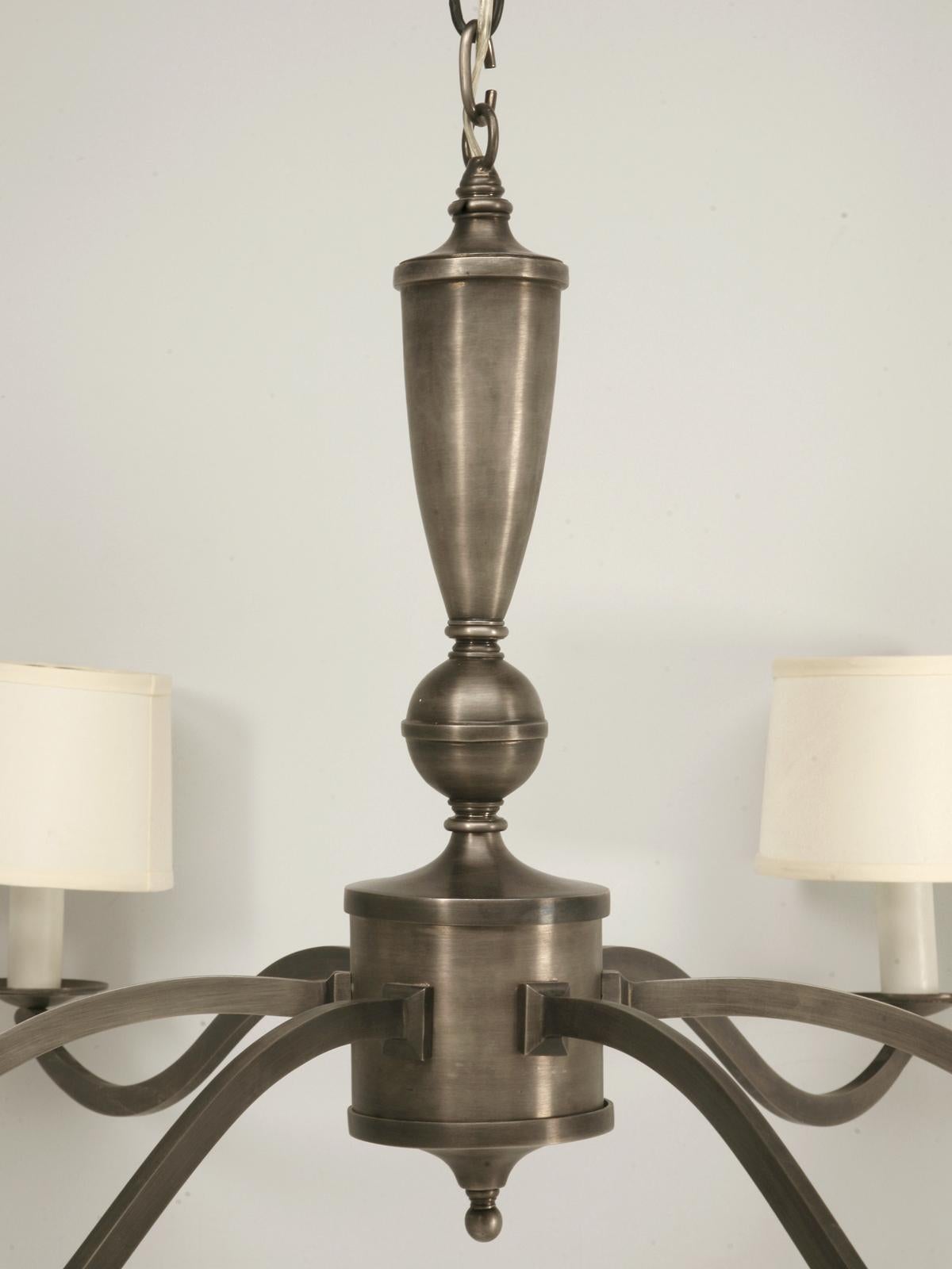 Unique large-scale transitional pewter chandelier. Although this fine chandelier has a diameter of 4 feet, it offers plenty of charm and character without overpowering the room. N.O.S. meaning, new old stock, but manufactured many years ago.