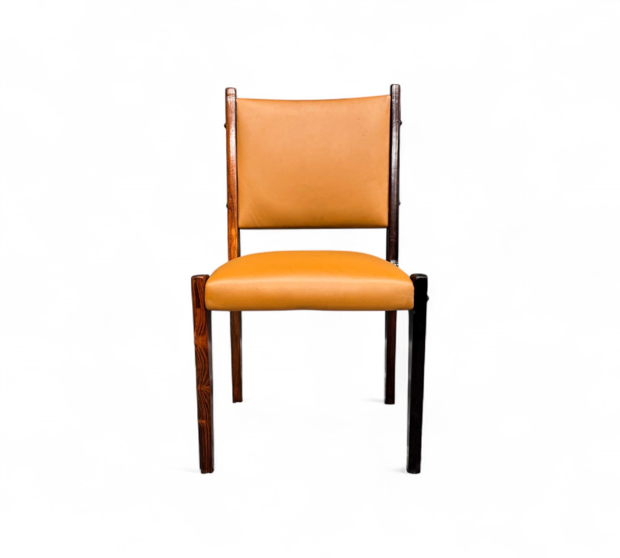 Available today, with domestic shipping in NYC metro area included, This Brazilian Modern Set of 4 Dining Chairs in hardwood and Leather by Sergio Rodrigues is nothing less than gorgeous!  

Each of these four chairs showcases a solid hardwood