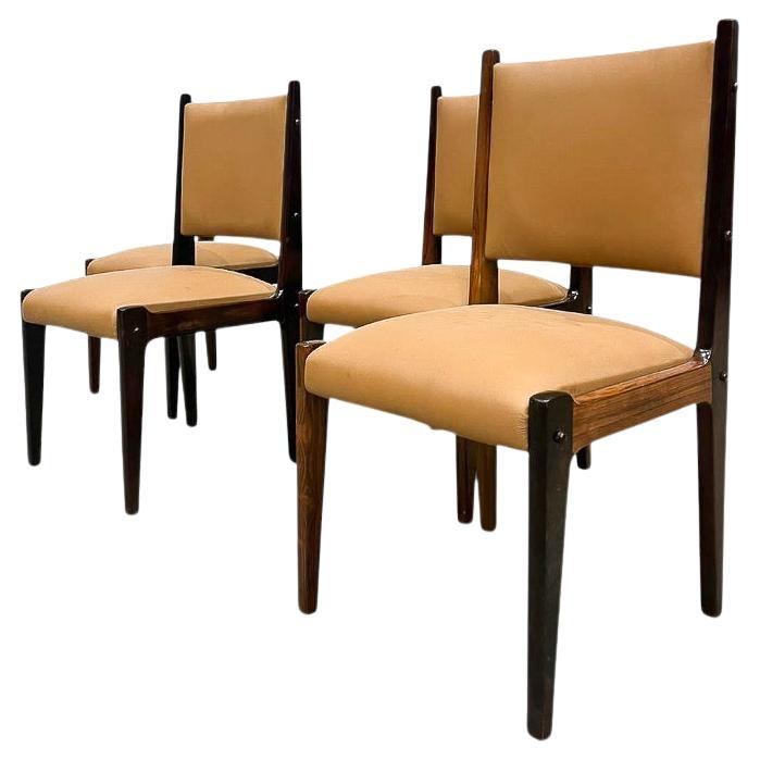 Available today, with domestic shipping in NYC metro area included, This Brazilian Modern Set of 4 Dining Chairs in hardwood and Leather by Sergio Rodrigues is nothing less than gorgeous!  

Each of these four chairs showcases a solid hardwood