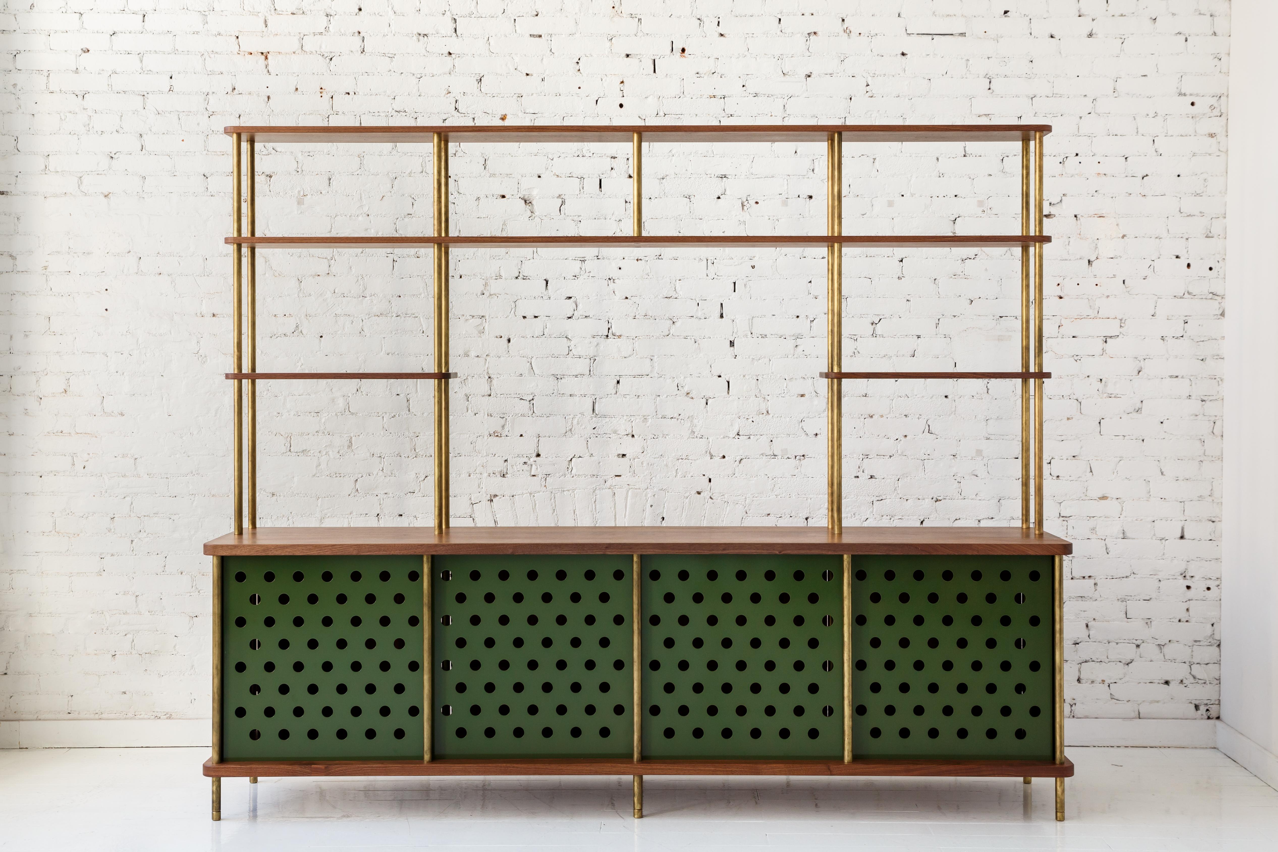 Consistent with the Strata collection, the new Strata Credenza is designed to be modular in order to create versatile configurations tailored to your needs. Immediately available as shown with brass rods, walnut shelving and four powder coated