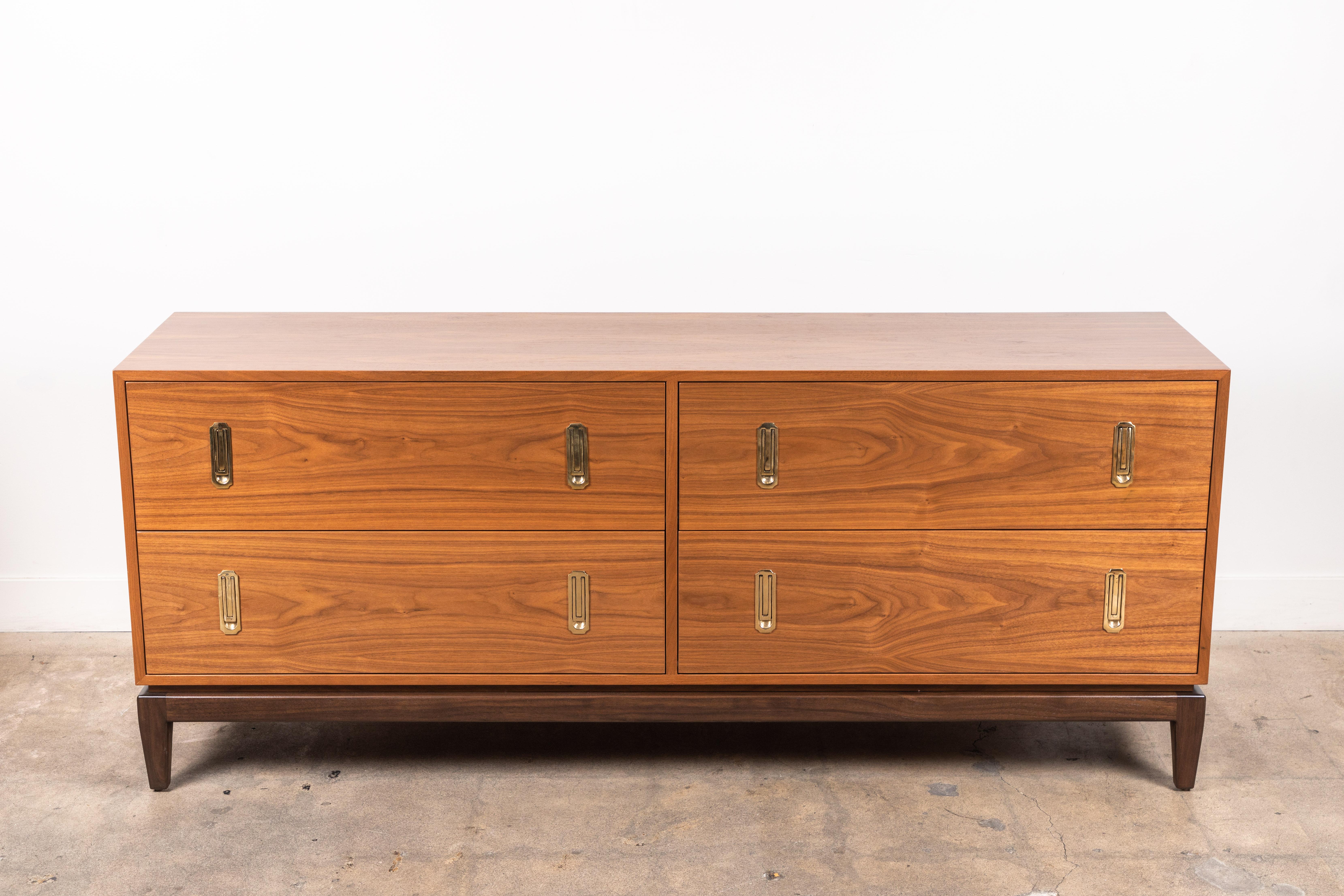The 4-drawer Arcadia chest features four drawers, cast brass hardware, and a sculptural solid American walnut or white oak base. Shown here in light walnut with dark walnut base. 

Available to order in various finishes with a 10-12 week lead