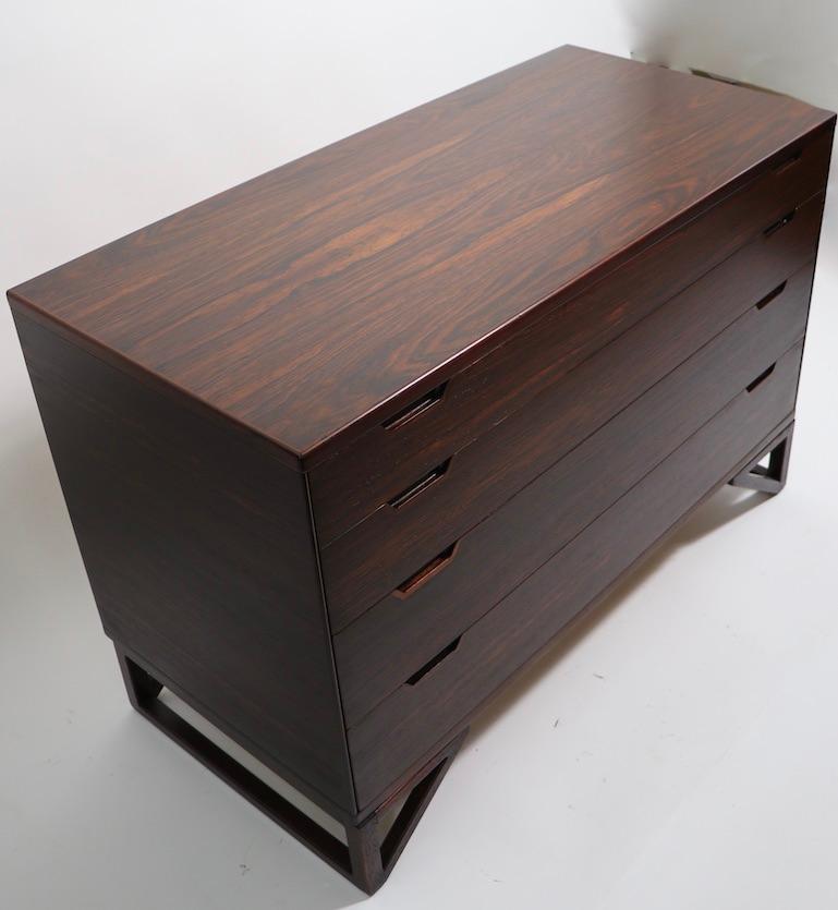 Stunning four drawer dresser by Svend Langkilde, made by Lankilde Mobler. This example is in very fine, original condition, clean and ready to use. Exceptional design, expected quality craftsmanship, and sophisticated style are all evident in this