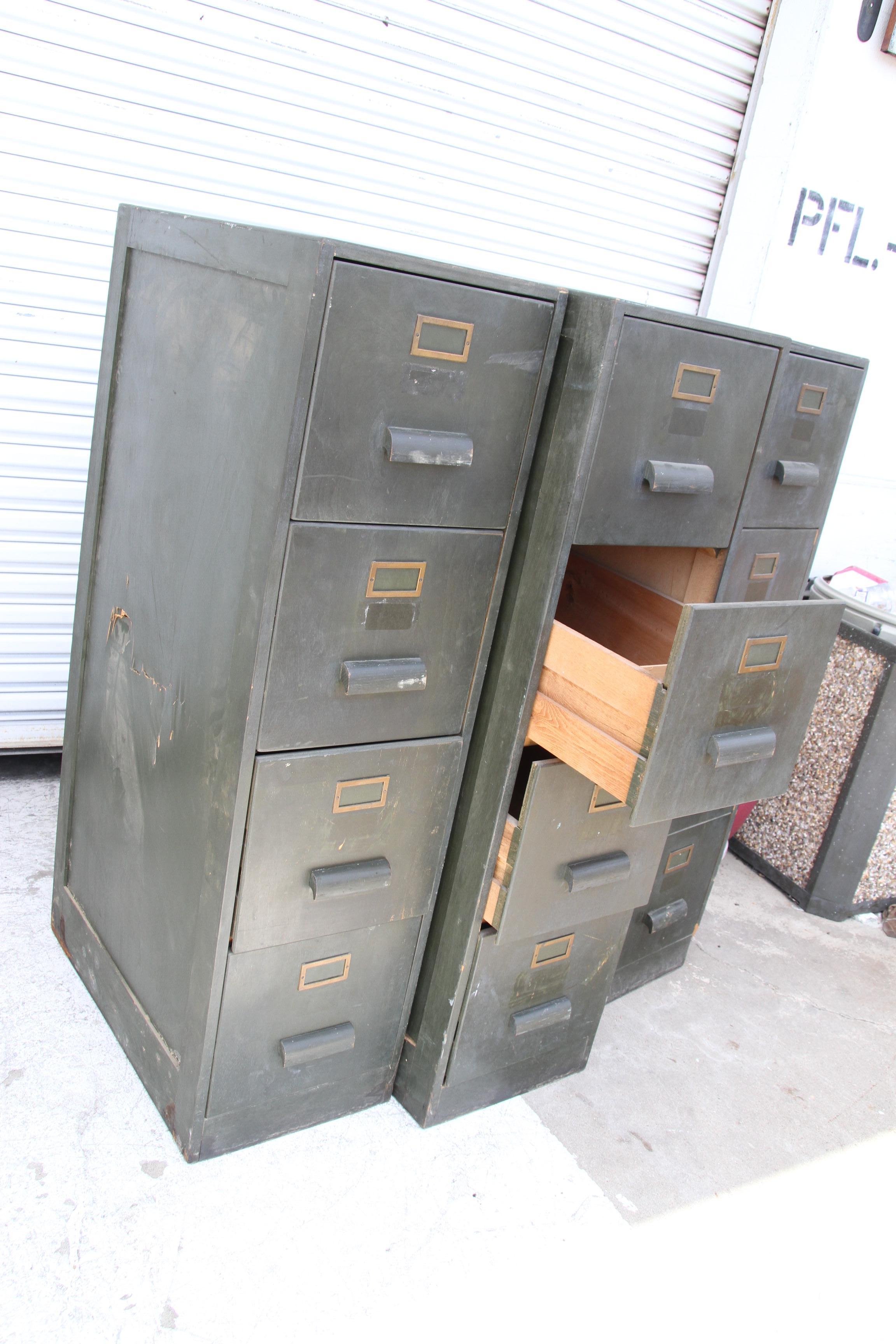 These file cabinets are antiquated and have 4 drawers. The paint is original to the cabinets. The pulls are wood and original to the cabinets.

Great for any office or library.

We have 4 file cabinets in stock.
Price is for 1 item.