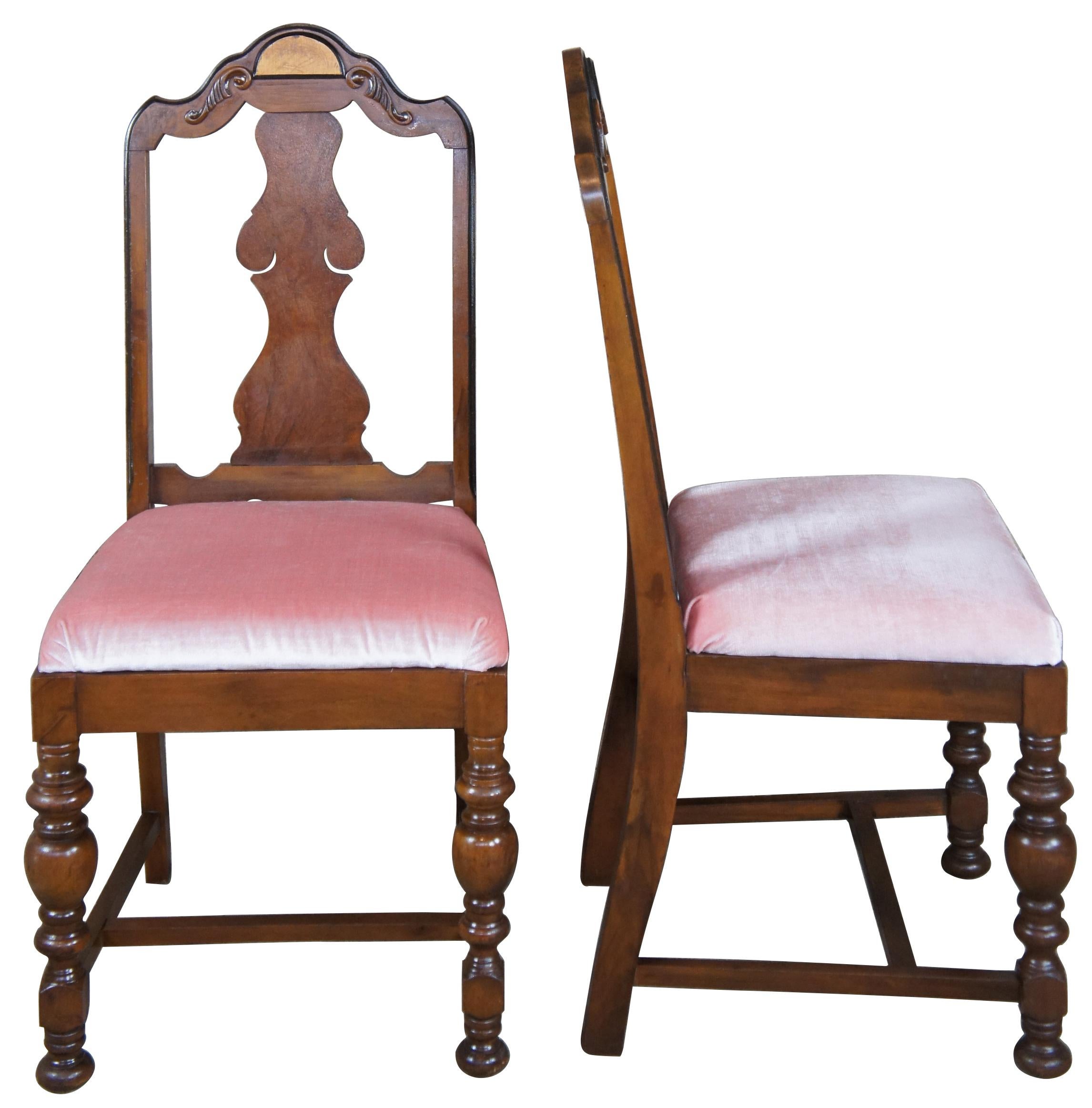 Early 20th century Jacobean style dining chairs. Made from walnut with an accent along crown. Features vase shaped splat, ab arhed crown with scrolled accents and turned baluster supports connected by an H-stretcher.
  